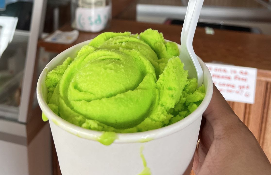 A cup of lime-flavored ice cream.