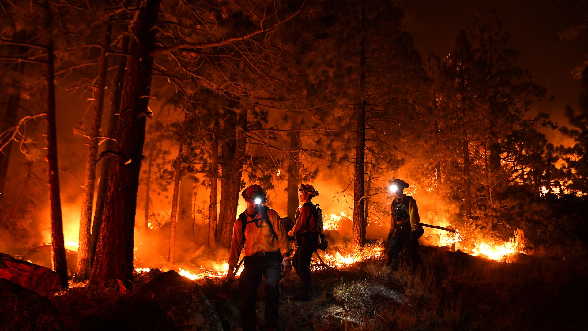 Firefighters battle battle the Caldor fire along highway 89 west of Lake Tahoe Thursday.
