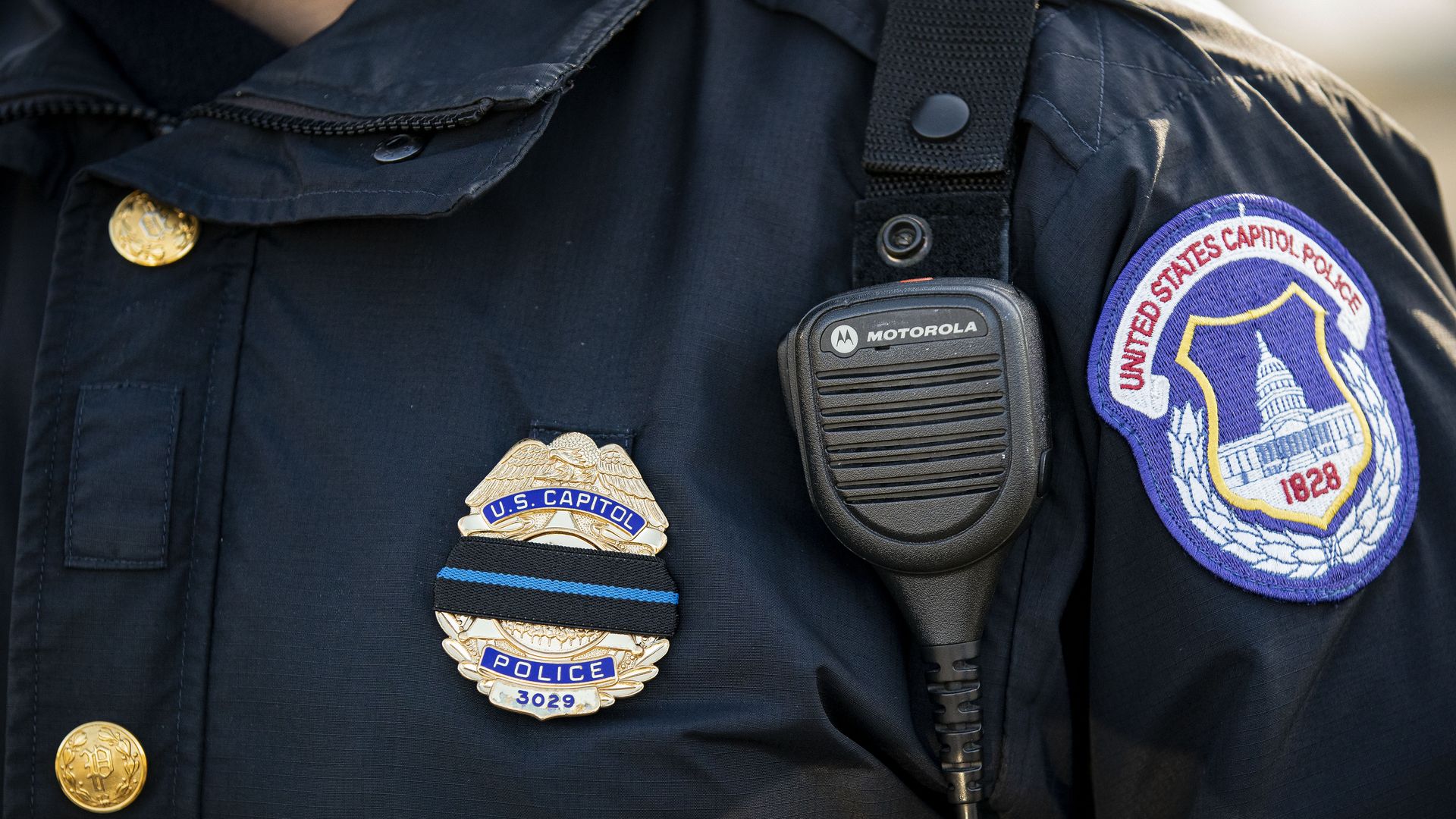 A mourning band is seen on the badge of a U.S. Capitol Police officer.