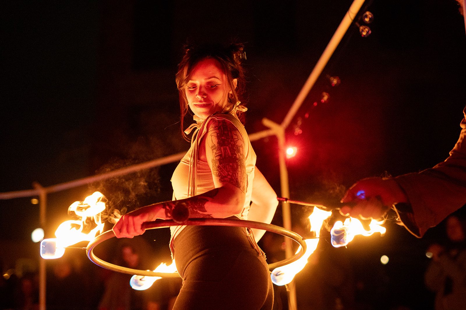 a woman performs in a literal ring for fire 