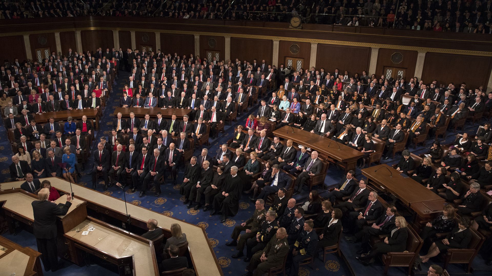 An aerial shot of Trump standing before Congress