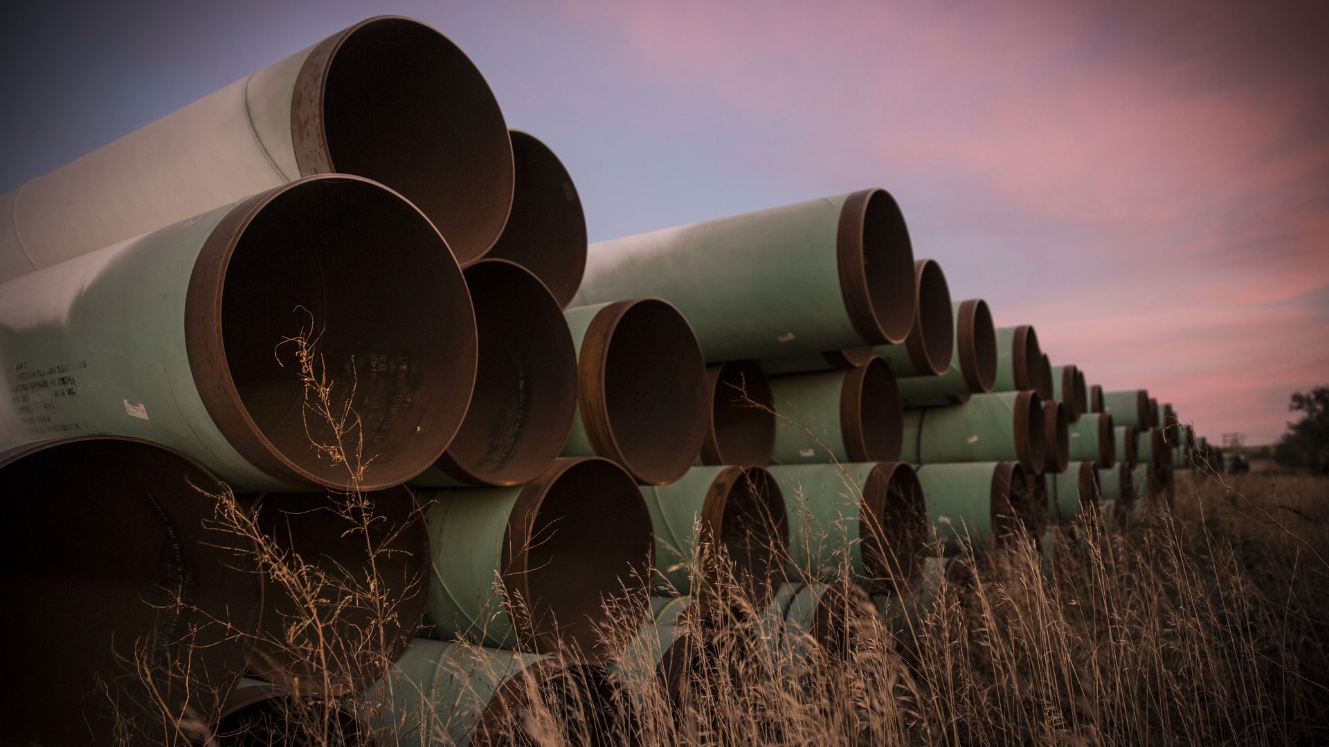 Pipes laying in a field 