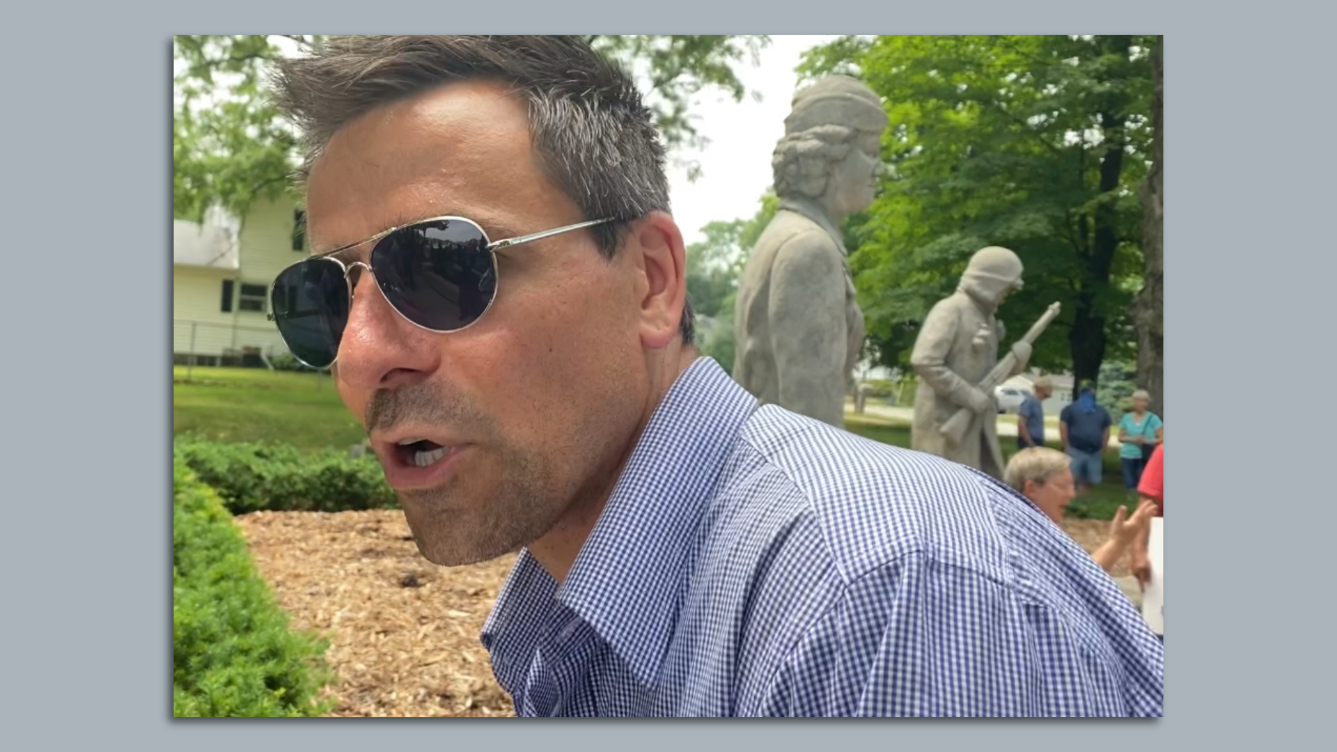 Ryan Kelley stands in front of a Confederate statue in Allendale in 2020.