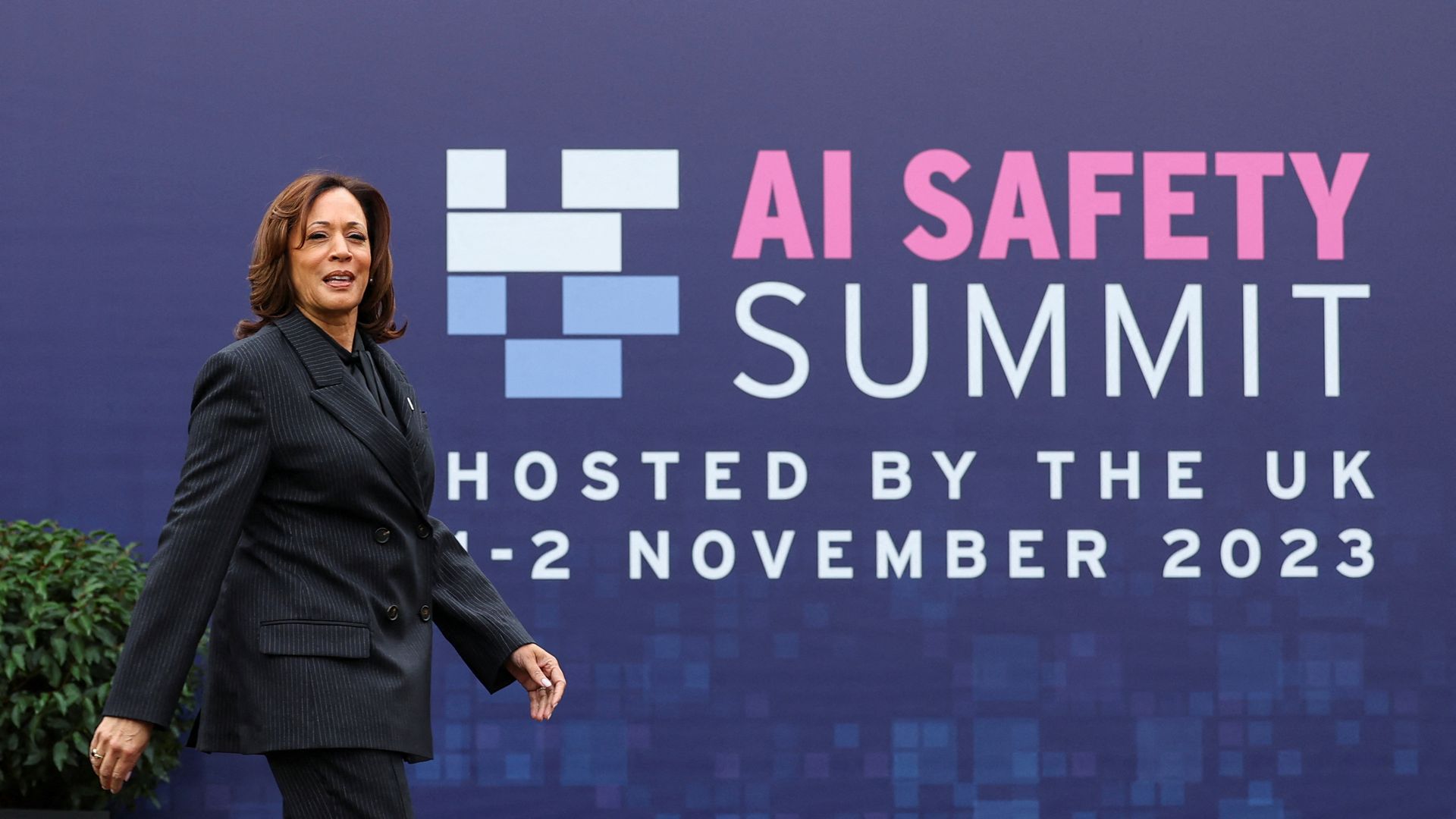 Vice President Kamala Harris walks across the stage at the UK AI Safety Summit