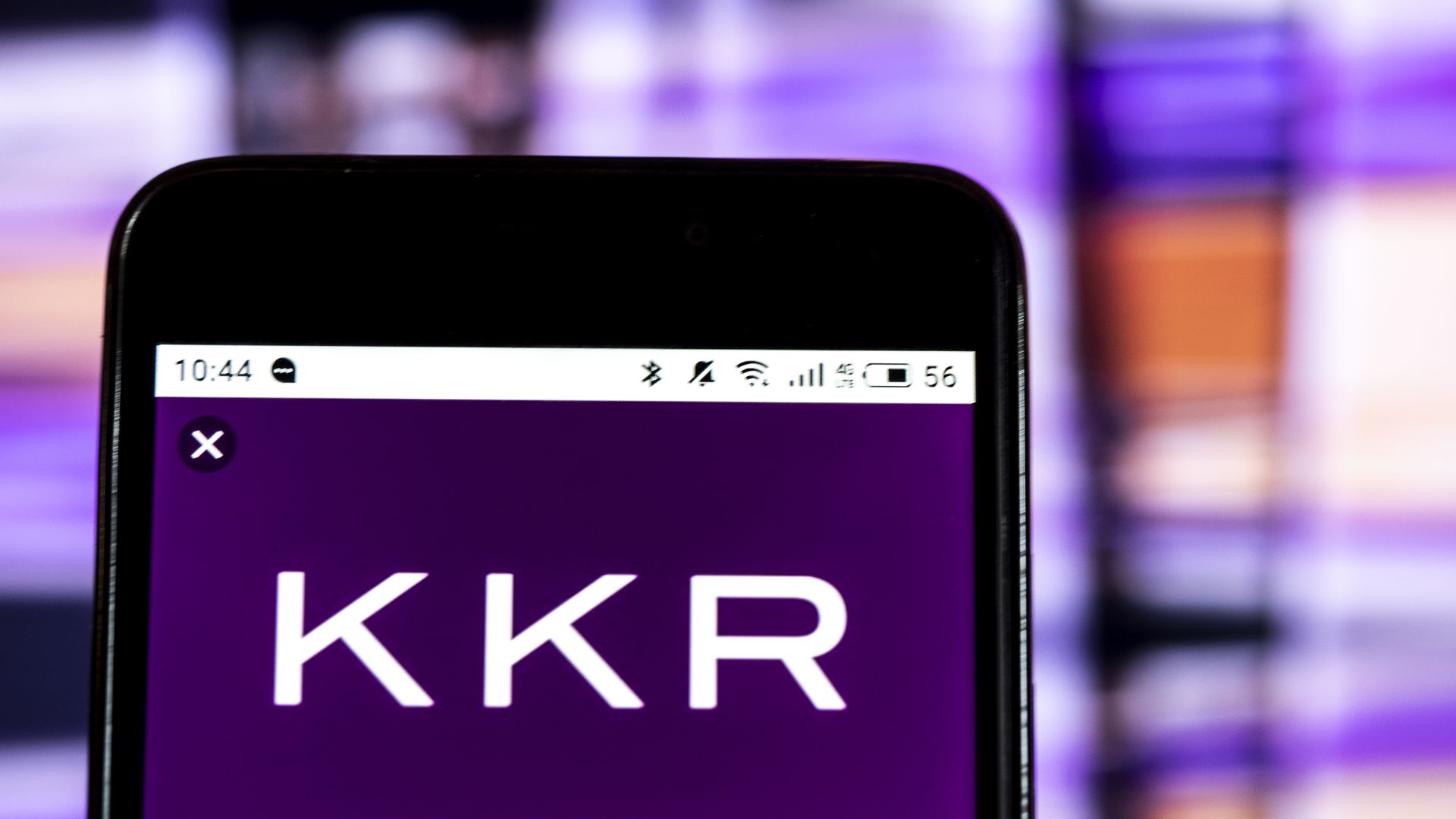 A KKR logo on a phone