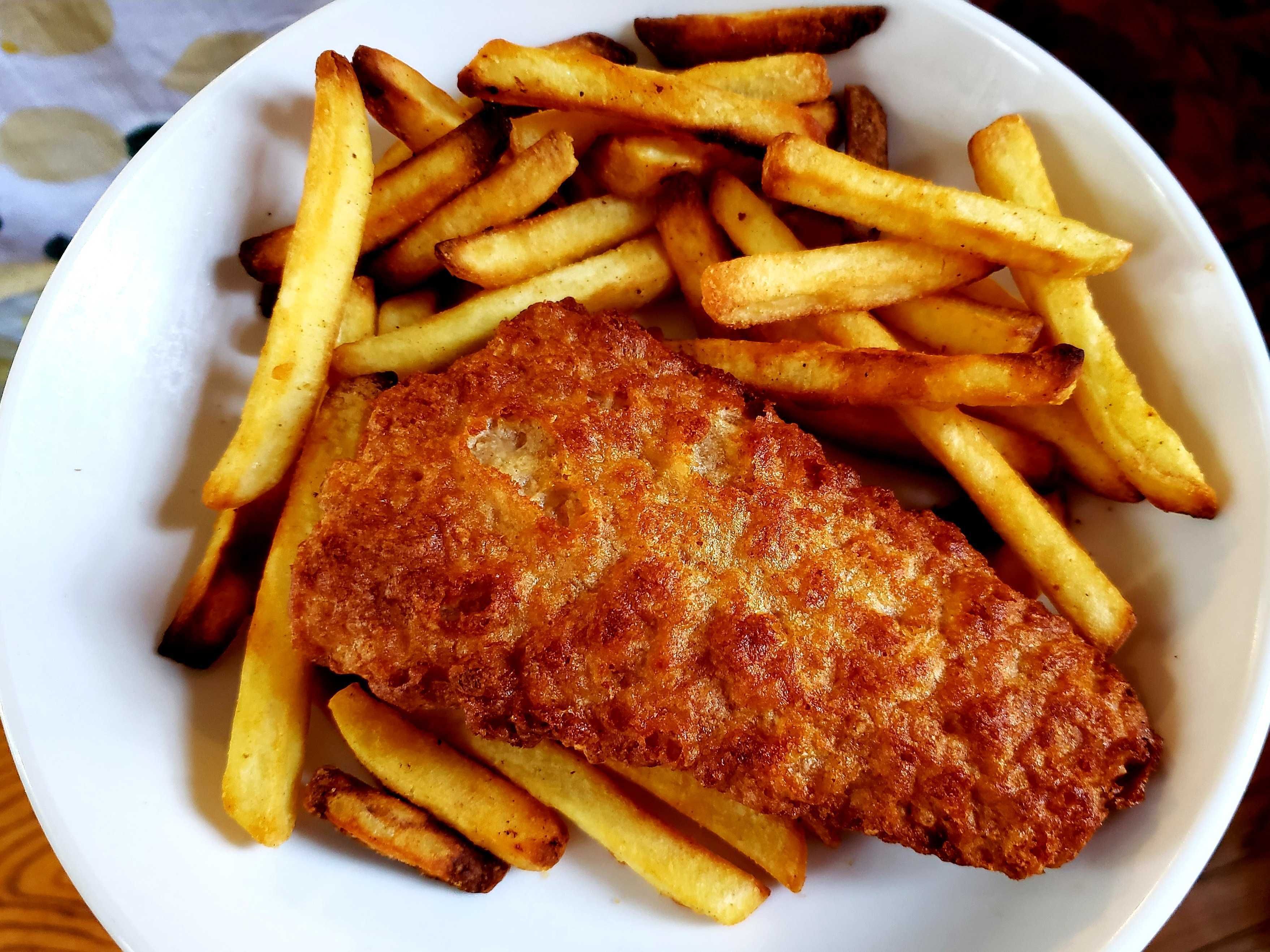 Photo of fried fish and french fries. 