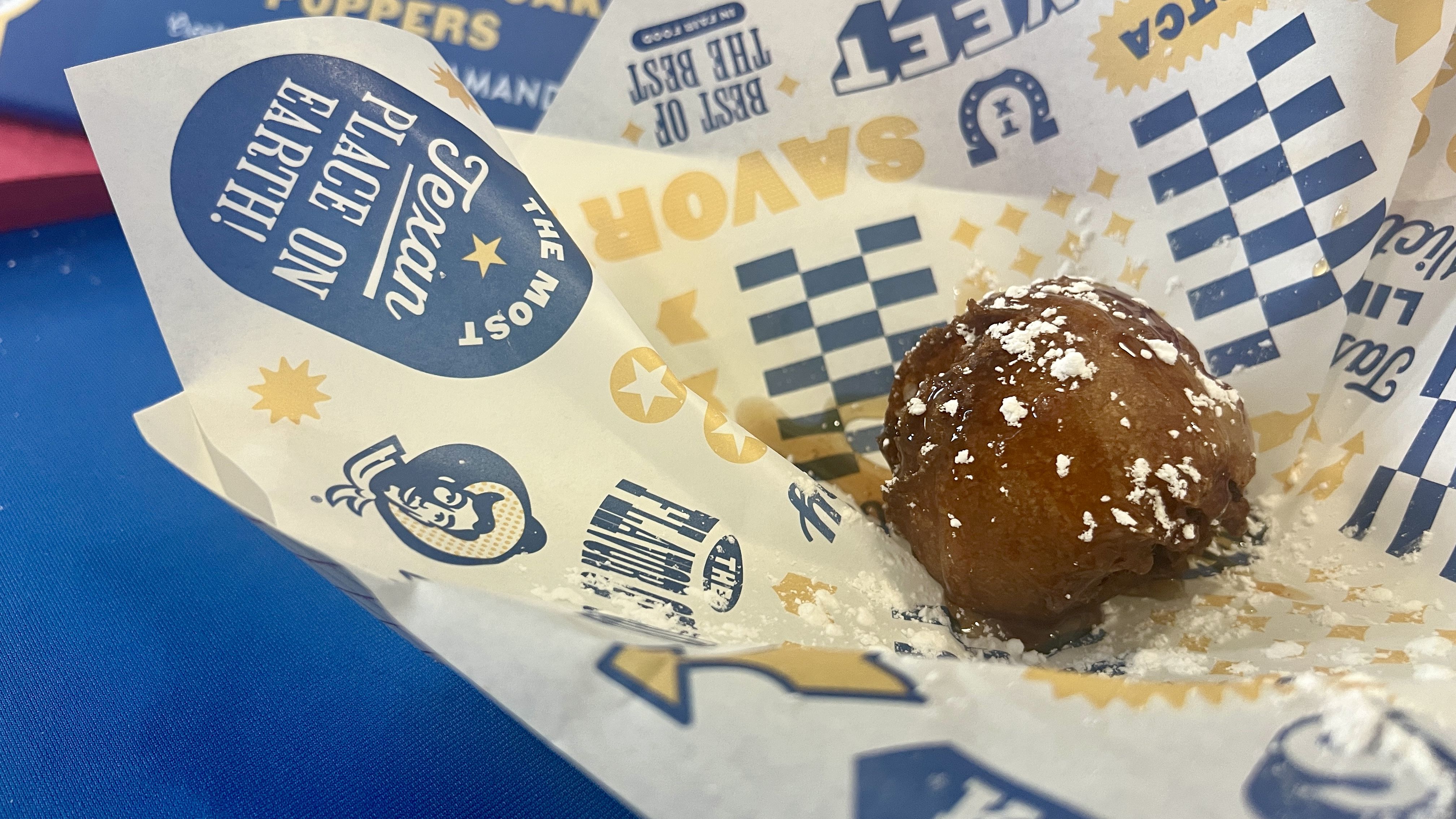 A ball of food on a paper tray