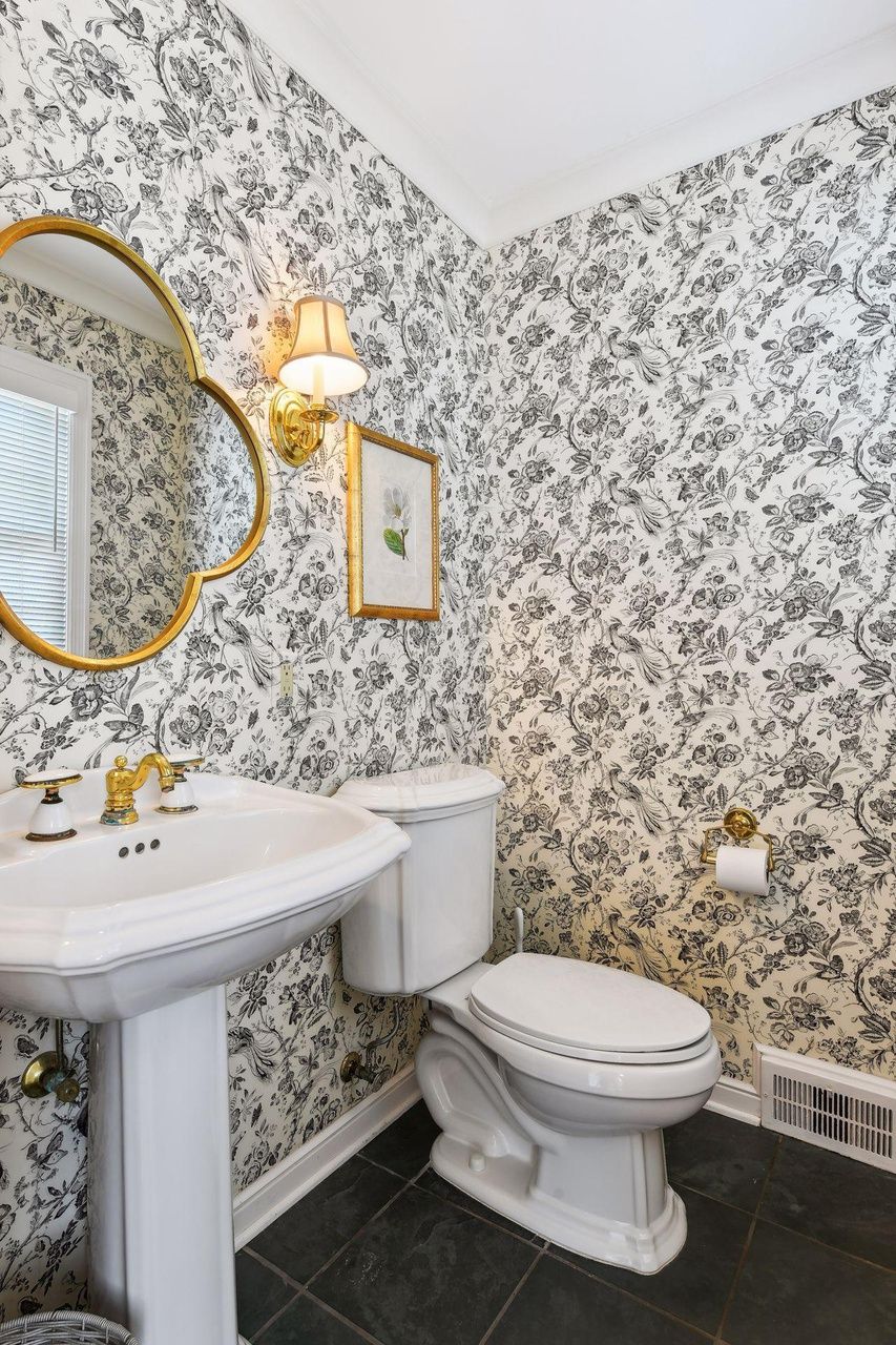 bathroom with floral wallpaper