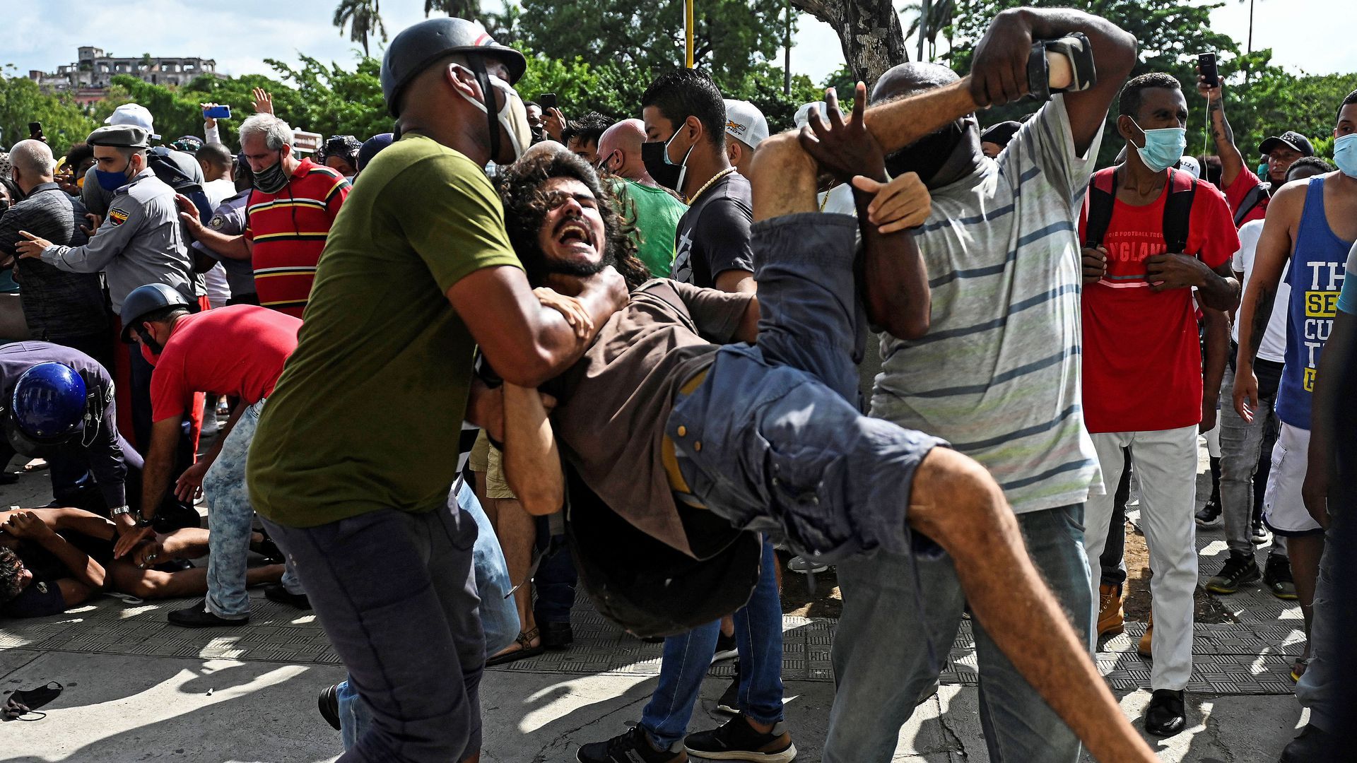 A young man, later identified as university student Leonardo Romero Negrín, is arrested during the July 11 protests.