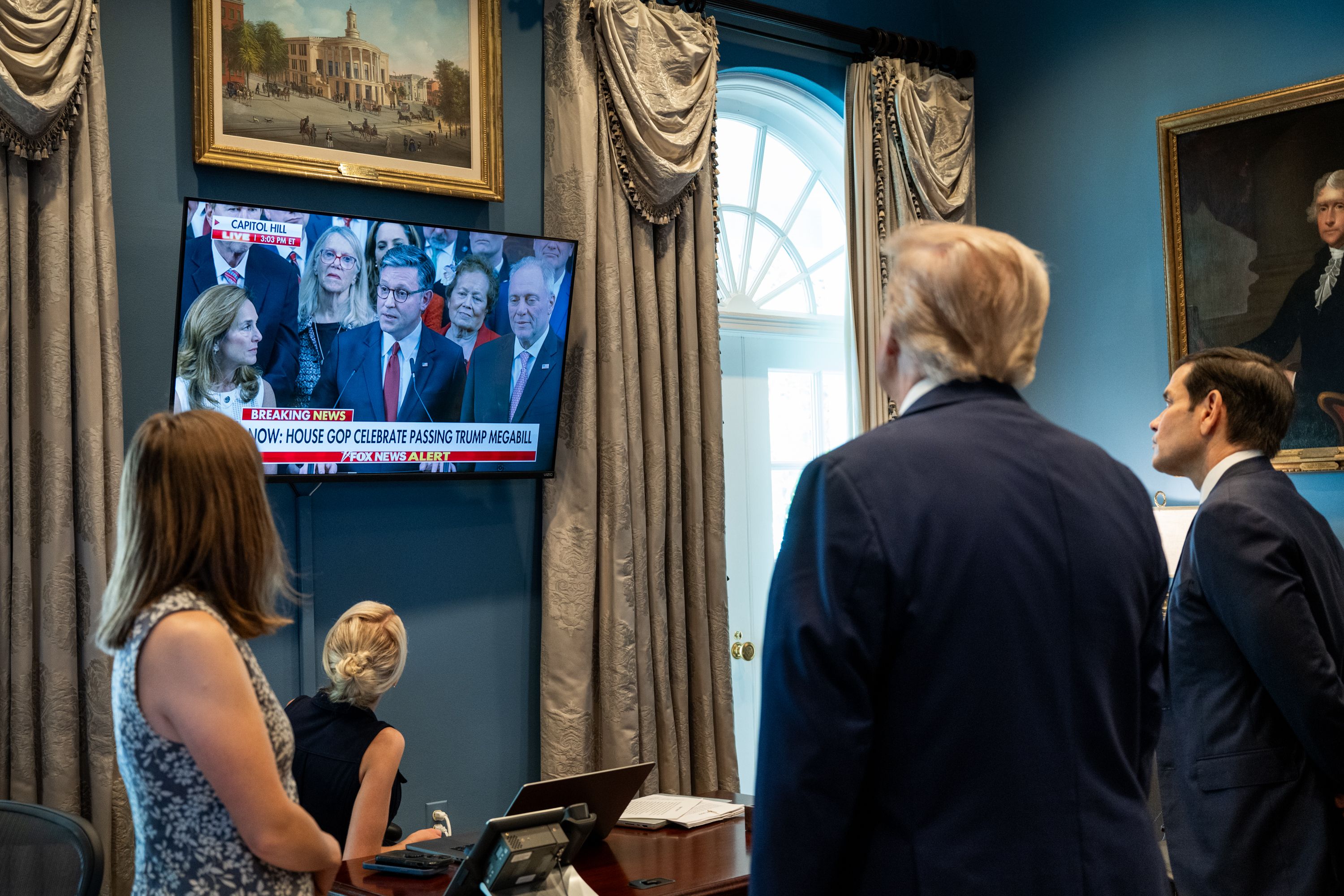 President Trump watches Speaker Johnson speak from Capitol Hill on TV after the House passed his "big, beautiful bill" yesterday.