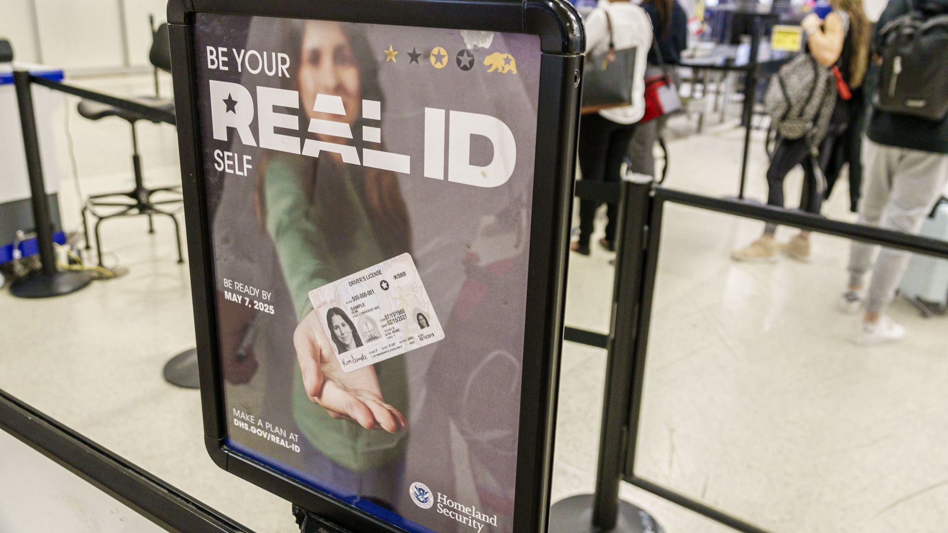A sign at an airport security checkpoint reminds travelers of the Real ID requirement starting May 7.