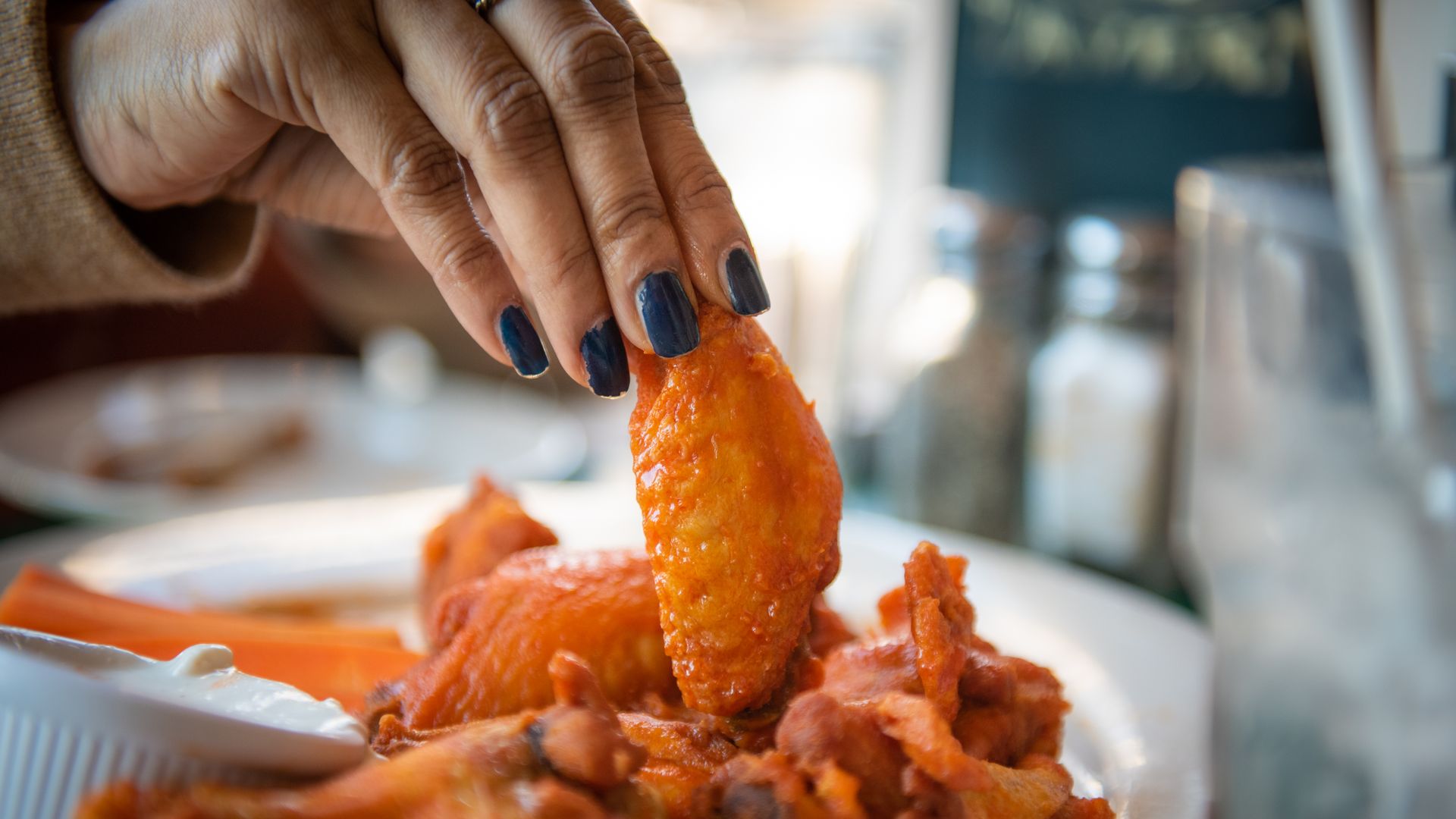 Chicken wings arranged at a restaurant in Hastings-on-Hudson, New York, US, on Friday, Feb. 10, 2023. The price of chicken wings has plunged 22% from last January while avocado prices are down 20% versus a year ago due to increased plantings and strong crop yields. Photographer: Tiffany Hagler-Geard