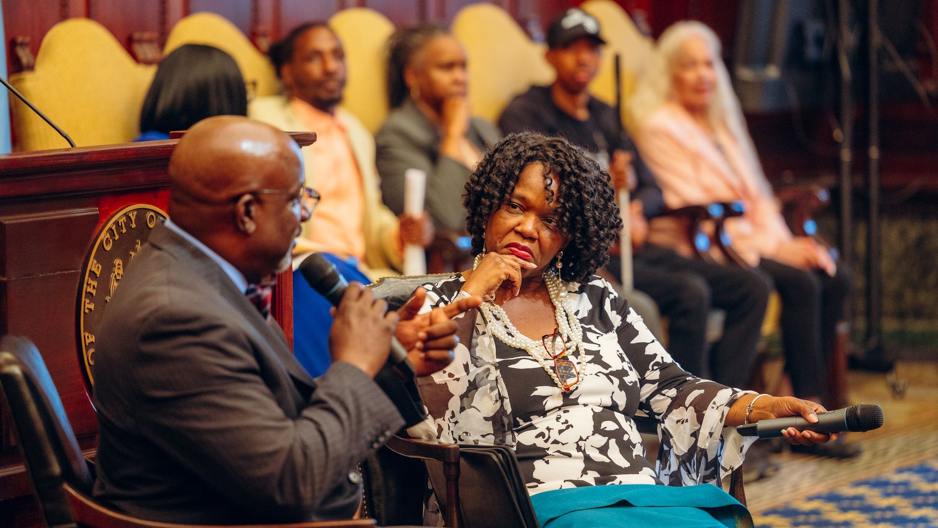 CPOC executive director Tonya McClary, right, answers questions from Rev. Mark Tyler during a town hall. 