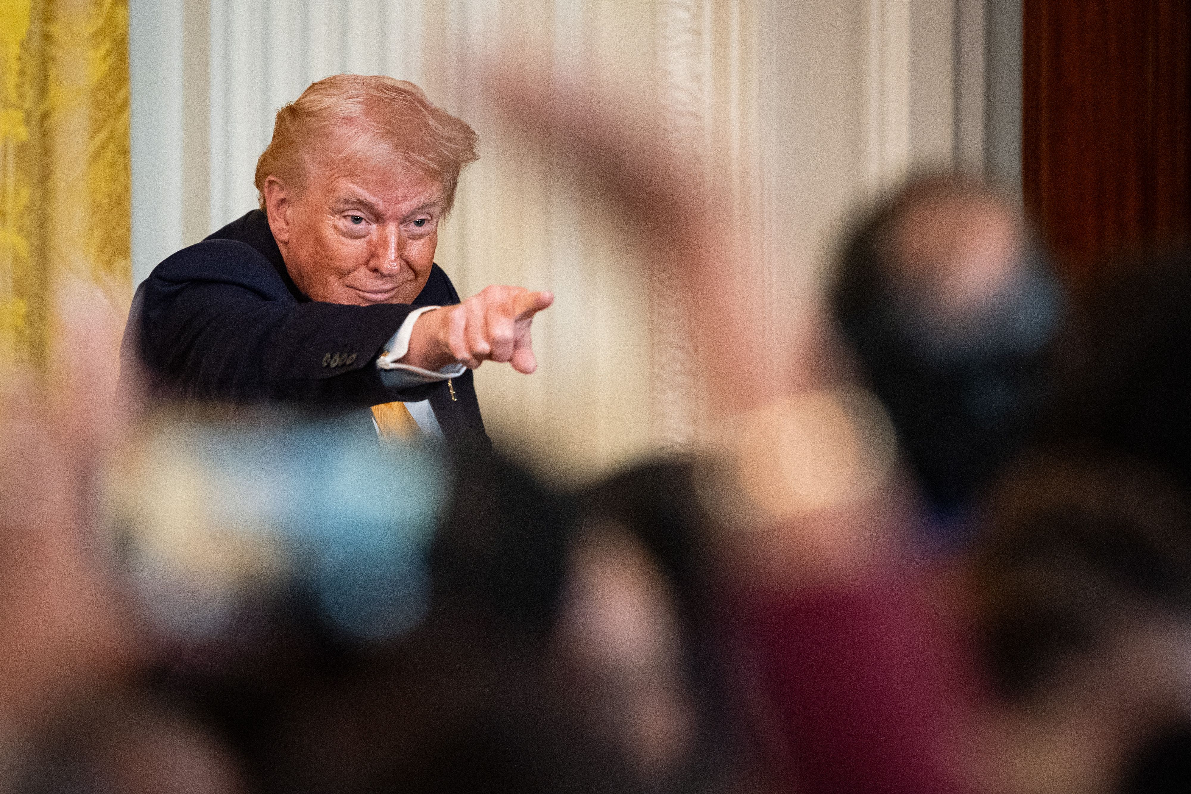 President Trump attends a Black History Month reception in the East Room of the White House yesterday.