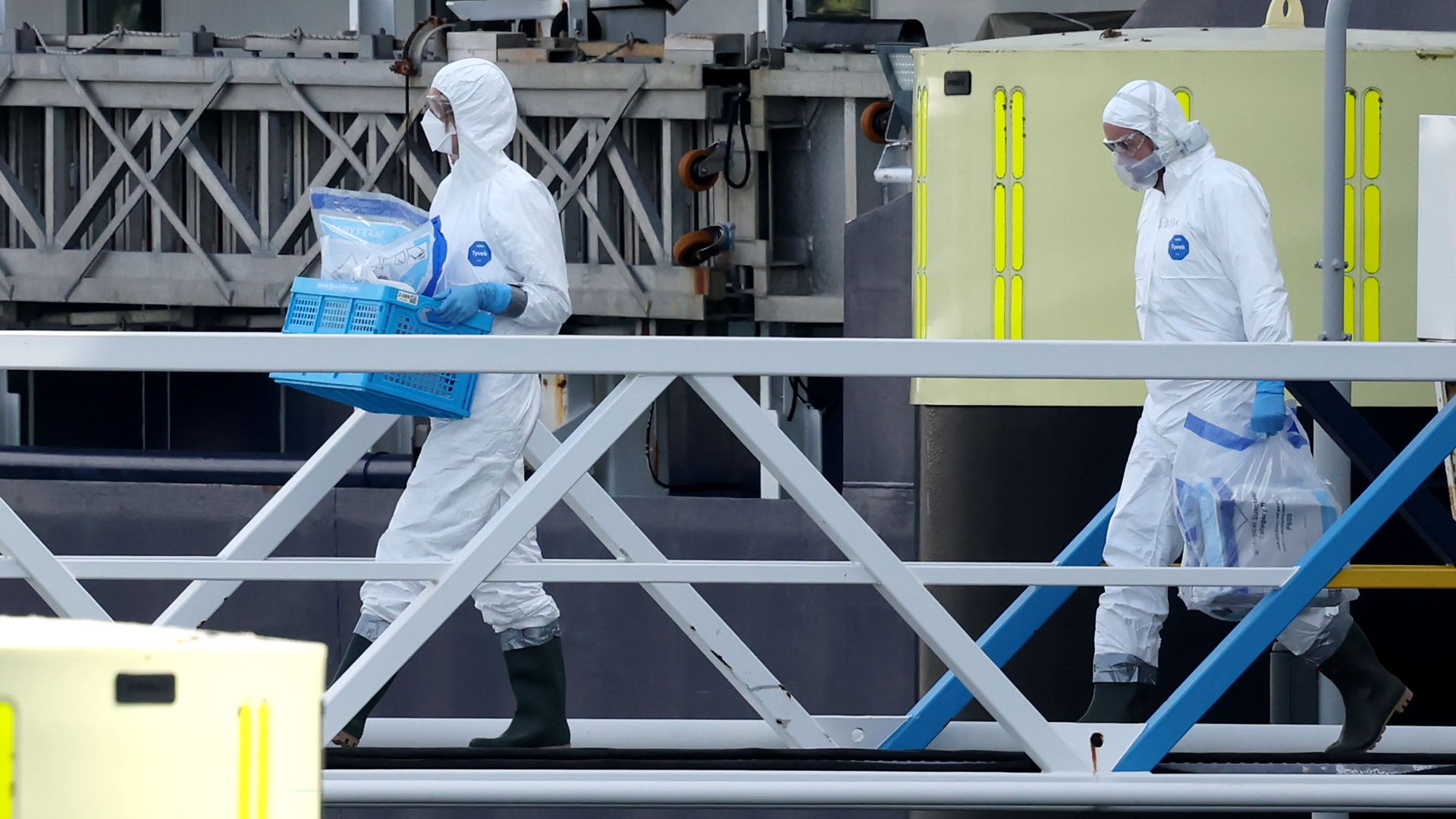 Workers disinfecting cruise ship that had hantavirus outbreak.