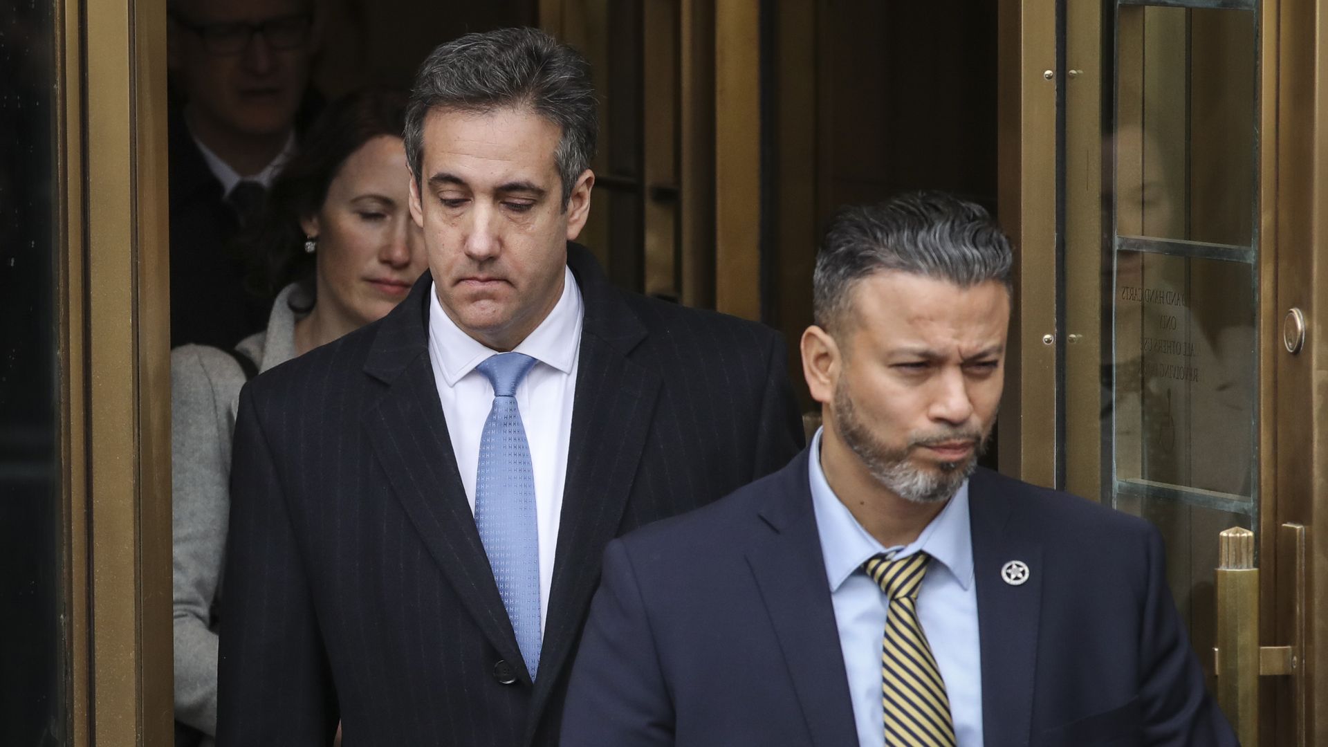 Michael Cohen, President Donald Trump's former personal attorney and fixer, exits federal court after his sentencing hearing