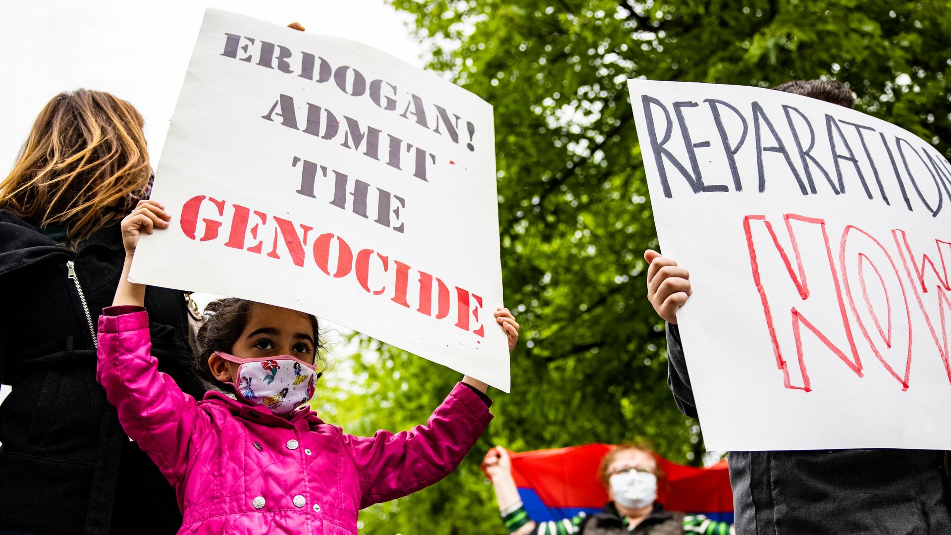 A child is seen protesting a World War I Armenian genocide outside the Turkish ambassador's residence in Washington. D.C.