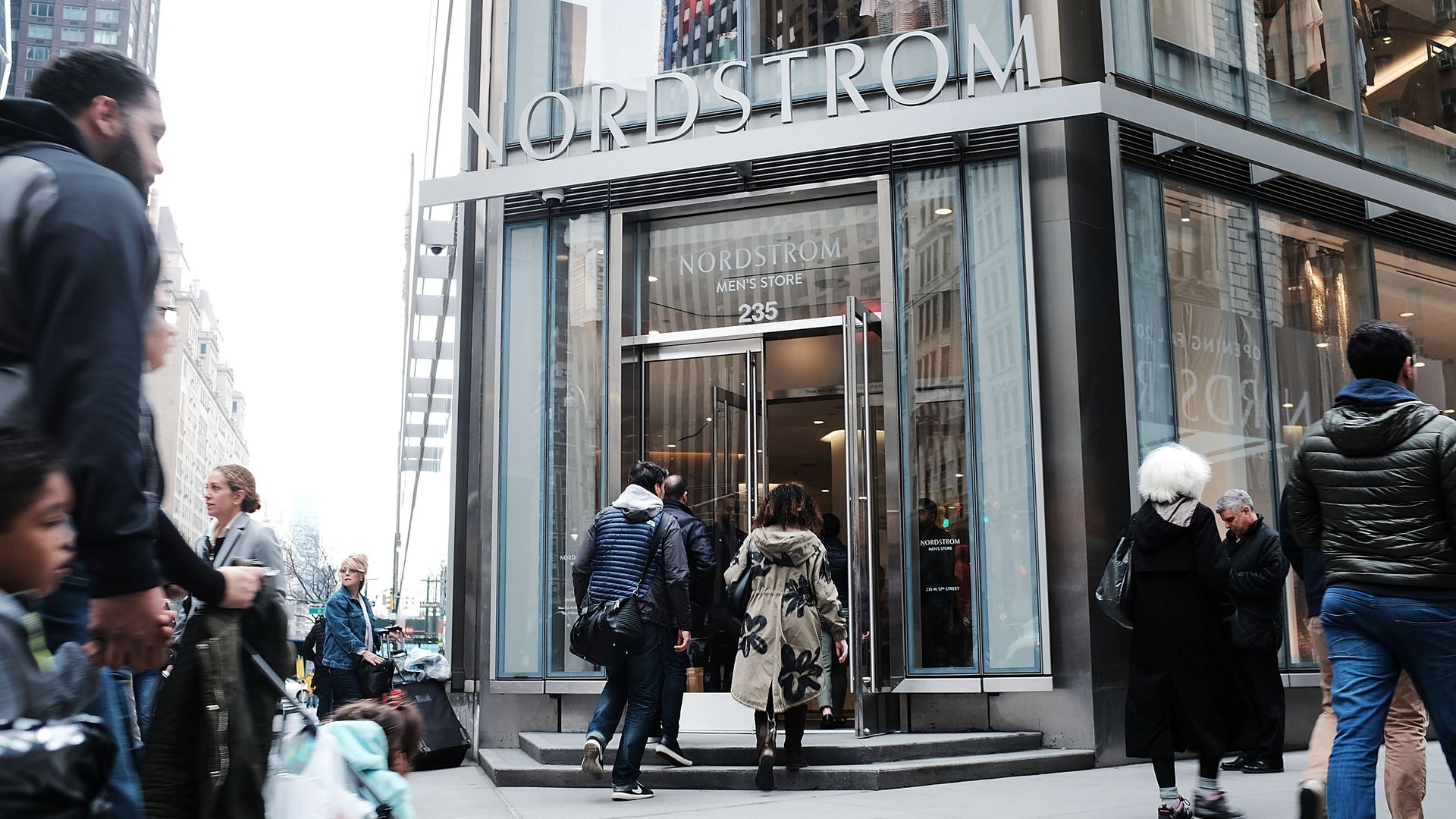 People walk by the newly opened Nordstrom menÕs store, the companyÕs first-ever Manhattan location