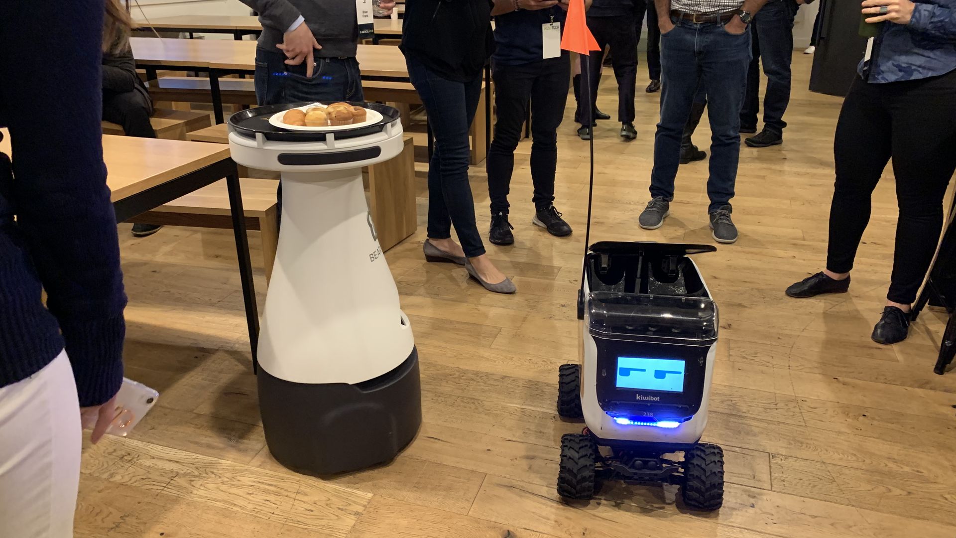 Photo of two food delivery bots