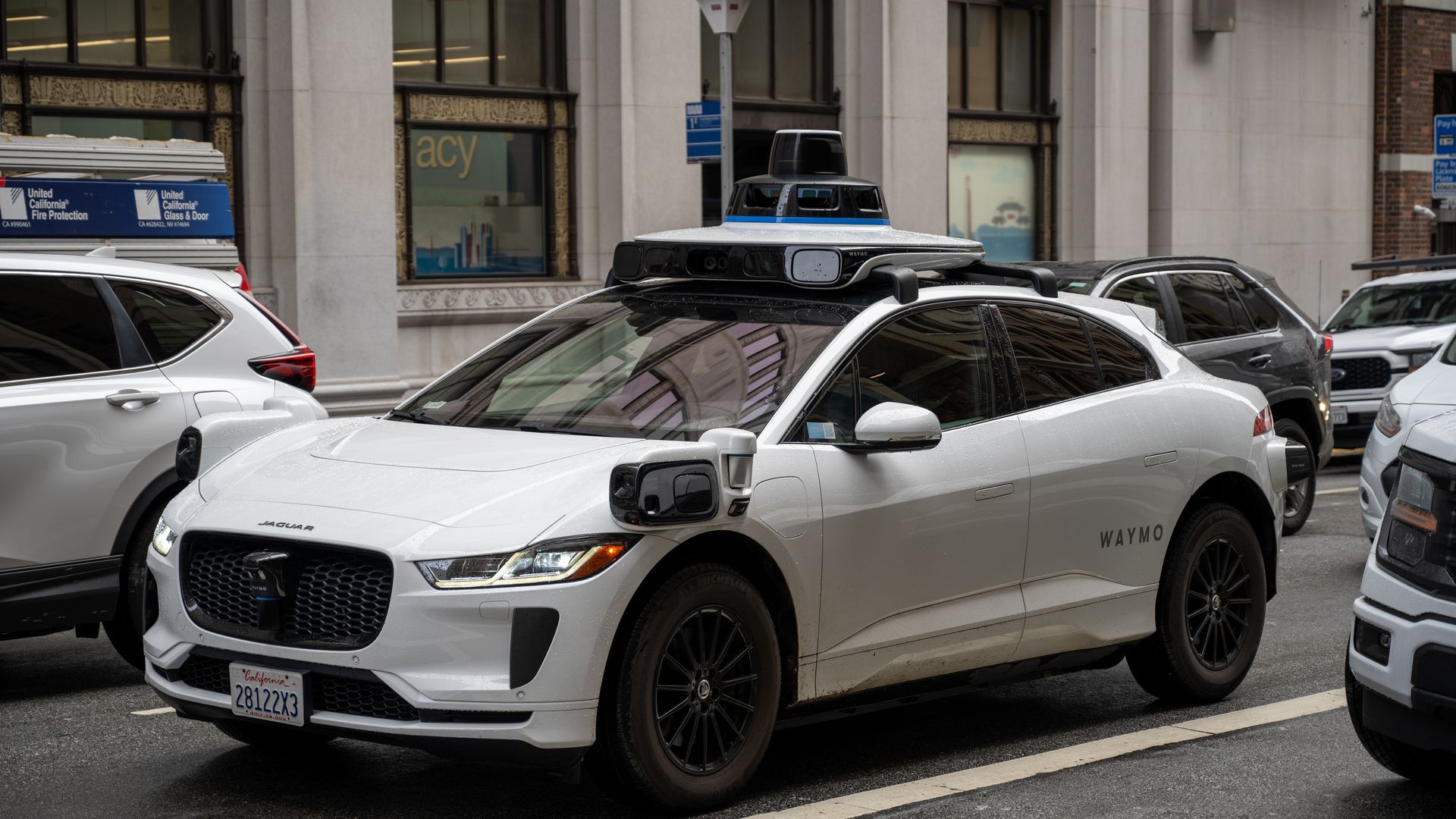 A waymo robotaxi with sensors and cameras