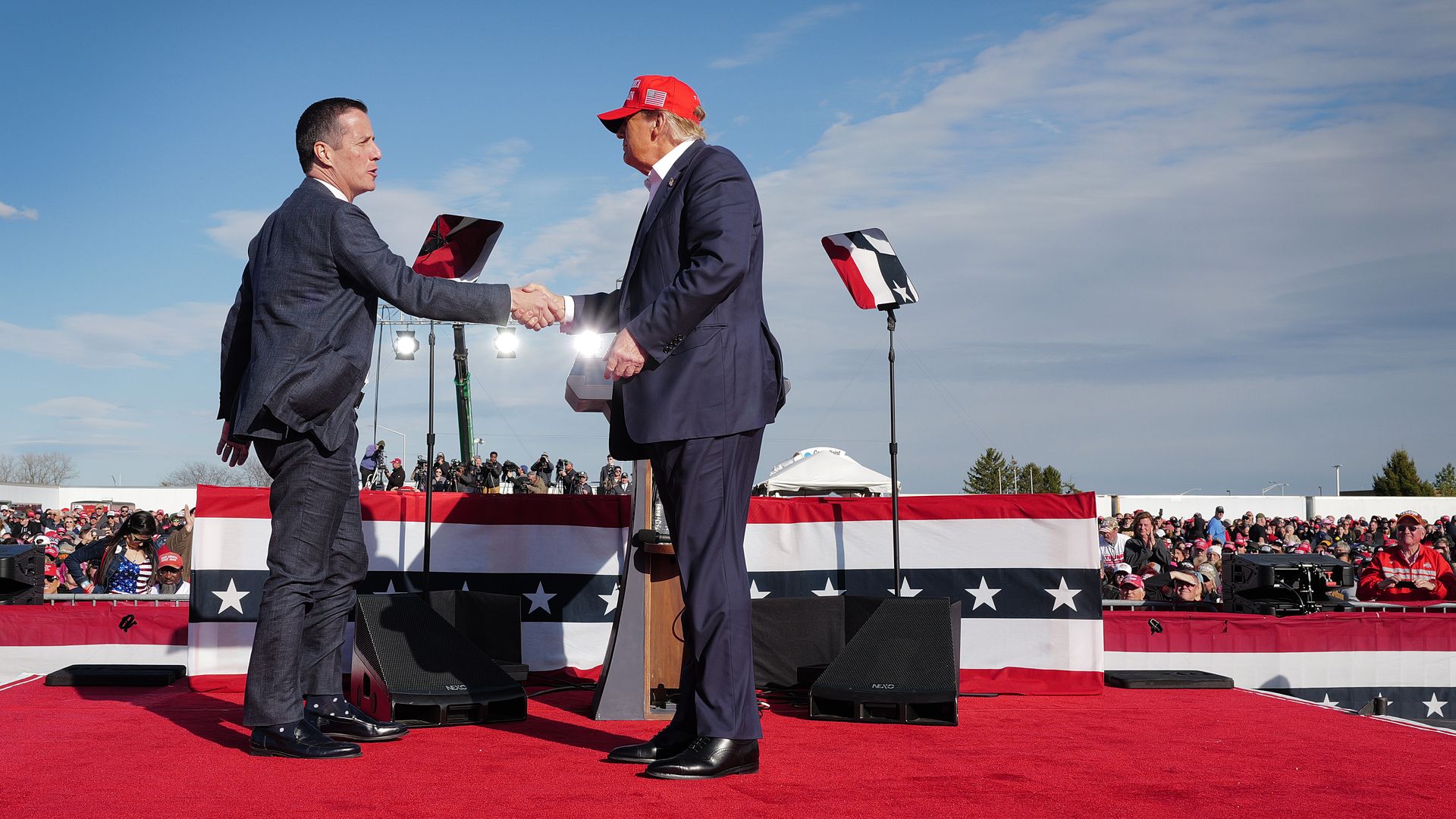 Republican presidential candidate former President Donald Trump greets Ohio Republican candidate for US Senate Bernie Moreno during a rally at the Dayton International Airport on March 16, 2024 in Vandalia, Ohio. 
