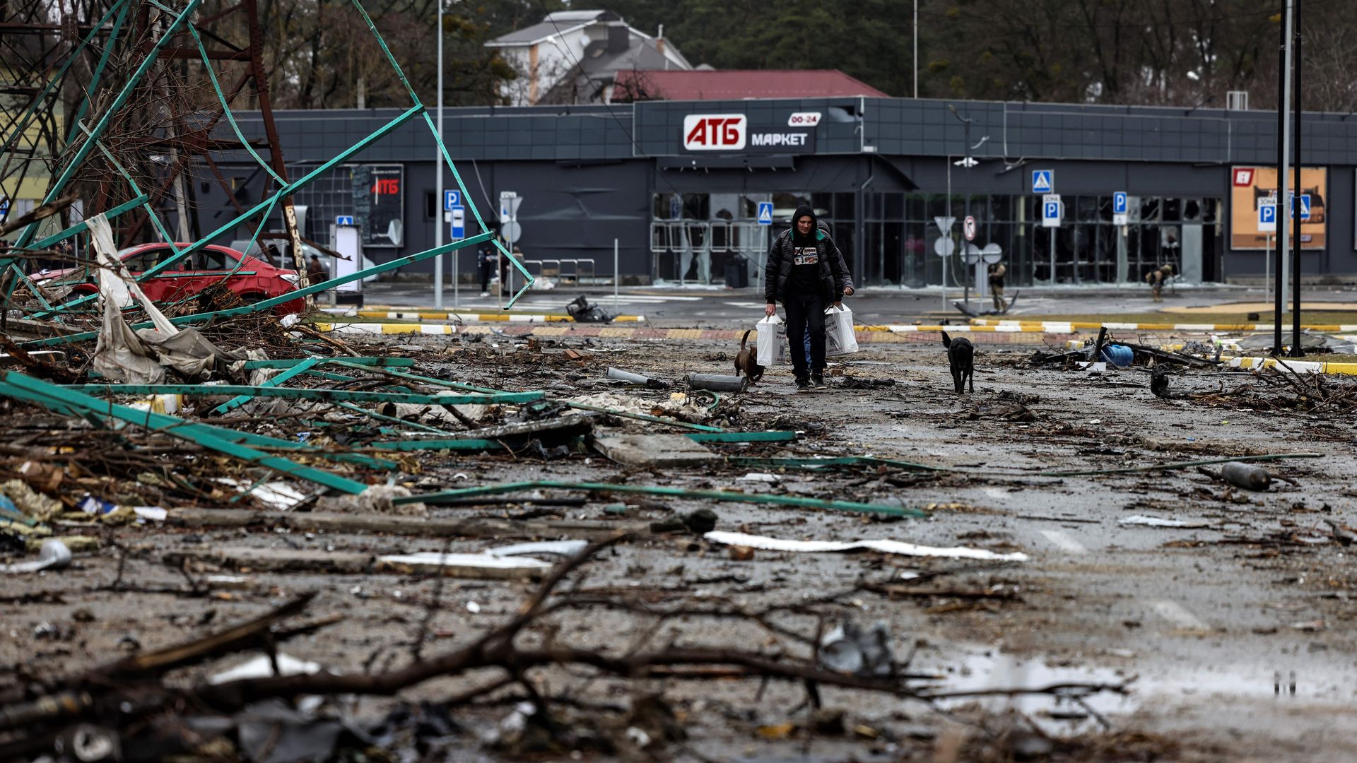 A man walks with bags of food gave for the Ukranian army in Bucha, northwest of Kyiv, on April 2.