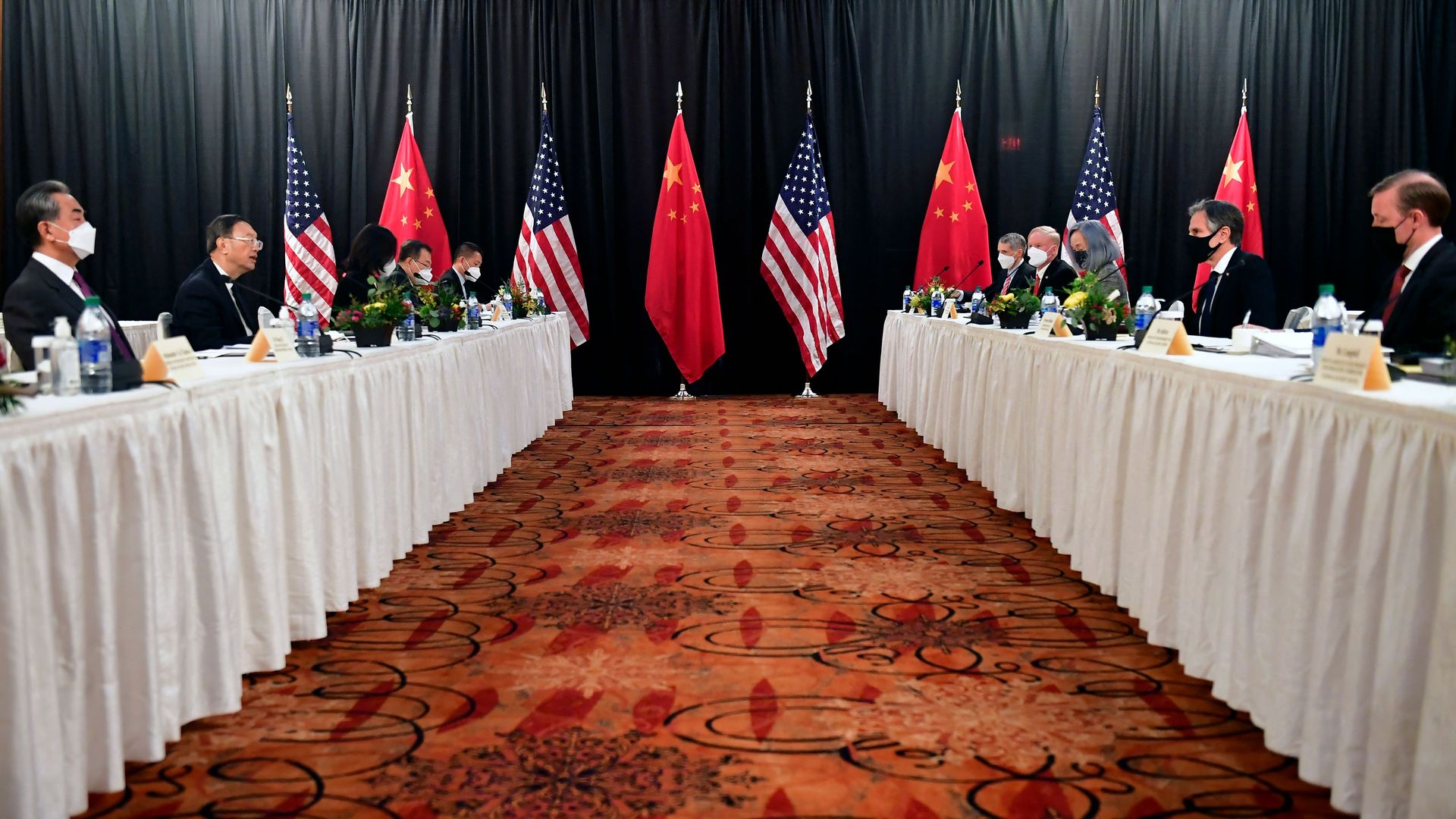 National Security Adviser Jake Sullivan and Secretary of State Tony Blinken are seen sitting across from their counterparts in Alaska in March.
