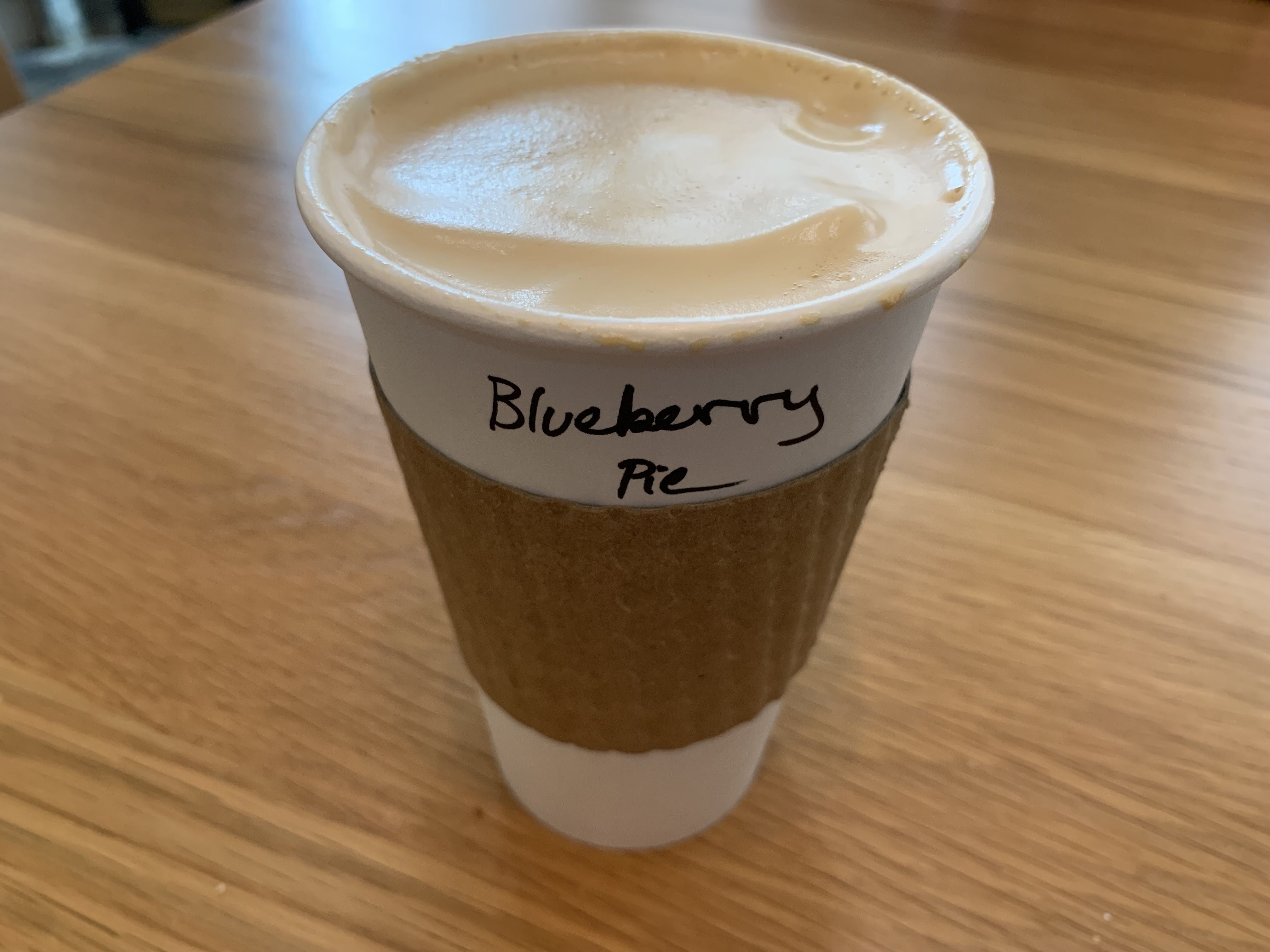 Photo of a cup of coffee on a table.
