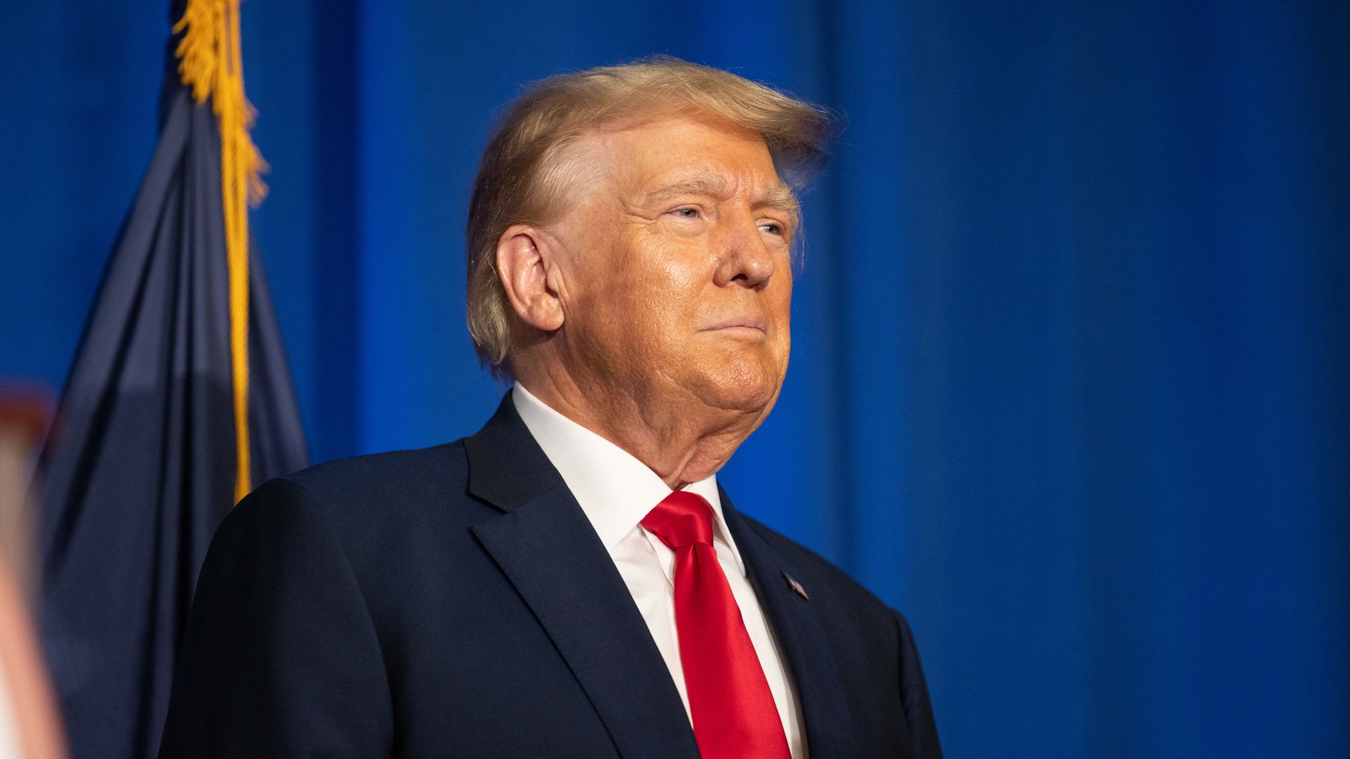 Republican presidential candidate, former U.S. President Donald Trump stands on stage after being introduced during the New Hampshire Federation of Republican Women's Lilac Luncheon on June 27, 2023 in Concord, New Hampshire