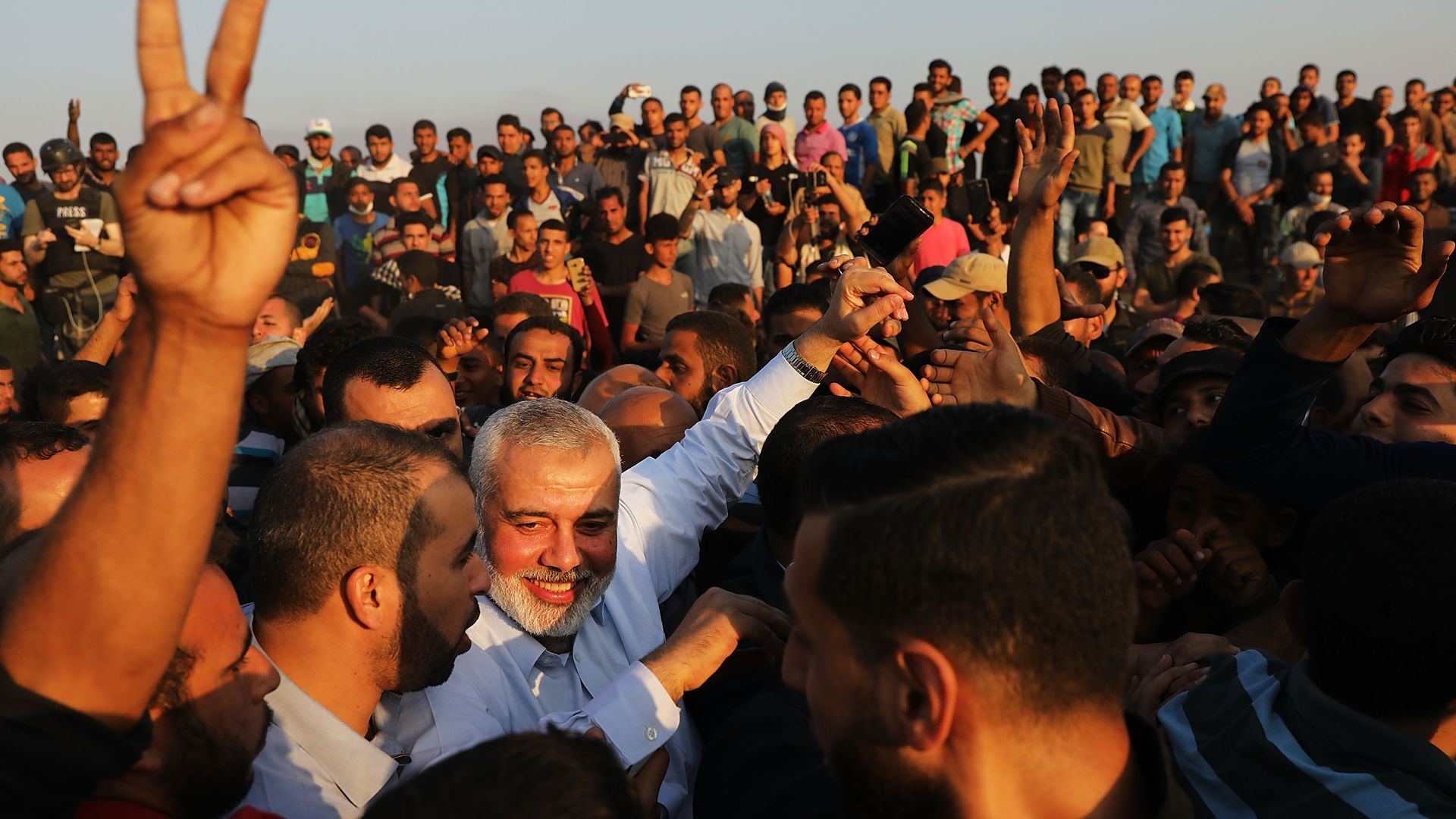 Hamas leader and people in the sun.
