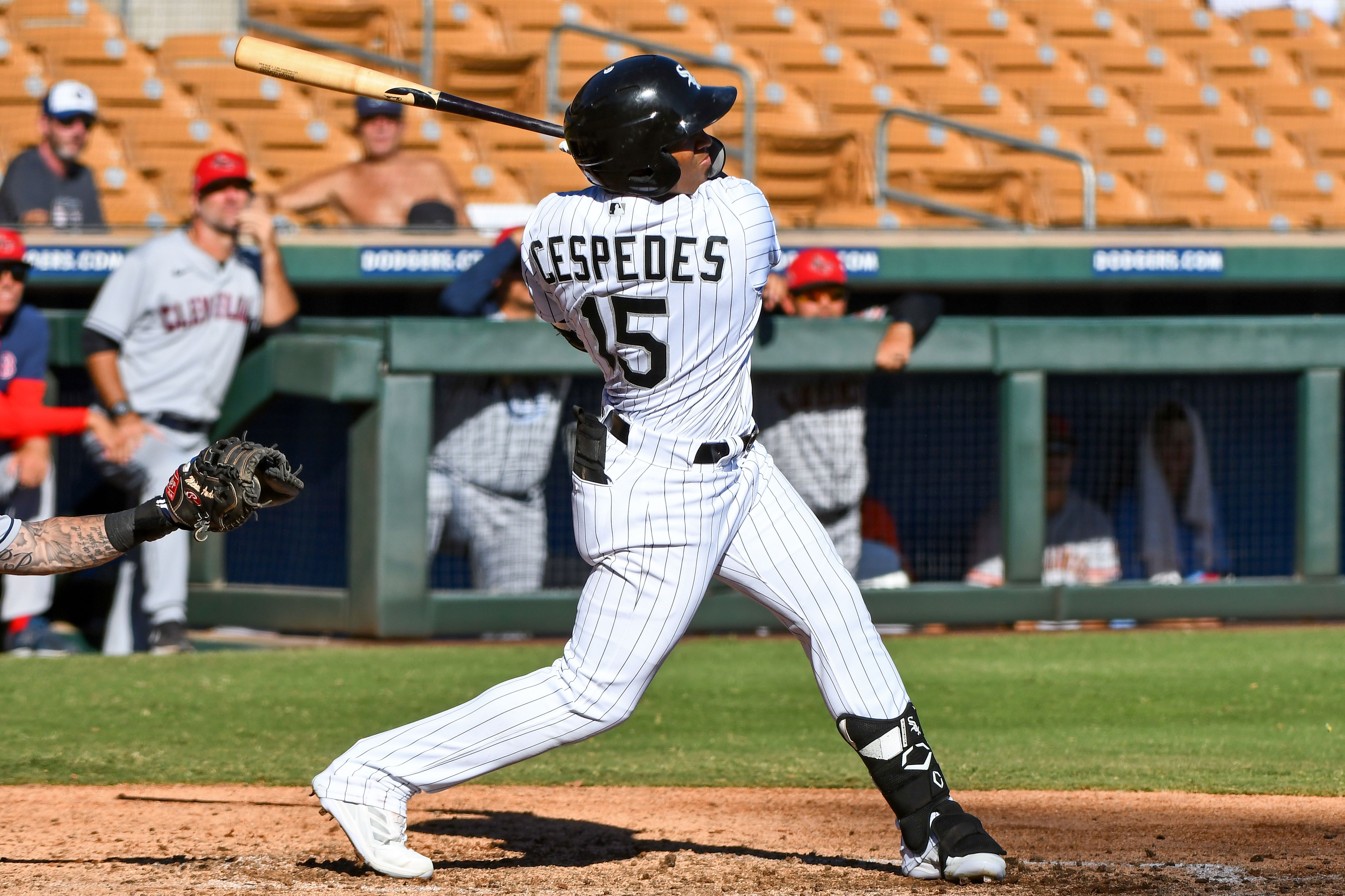 Photo of a baseball player swinging a bat. 