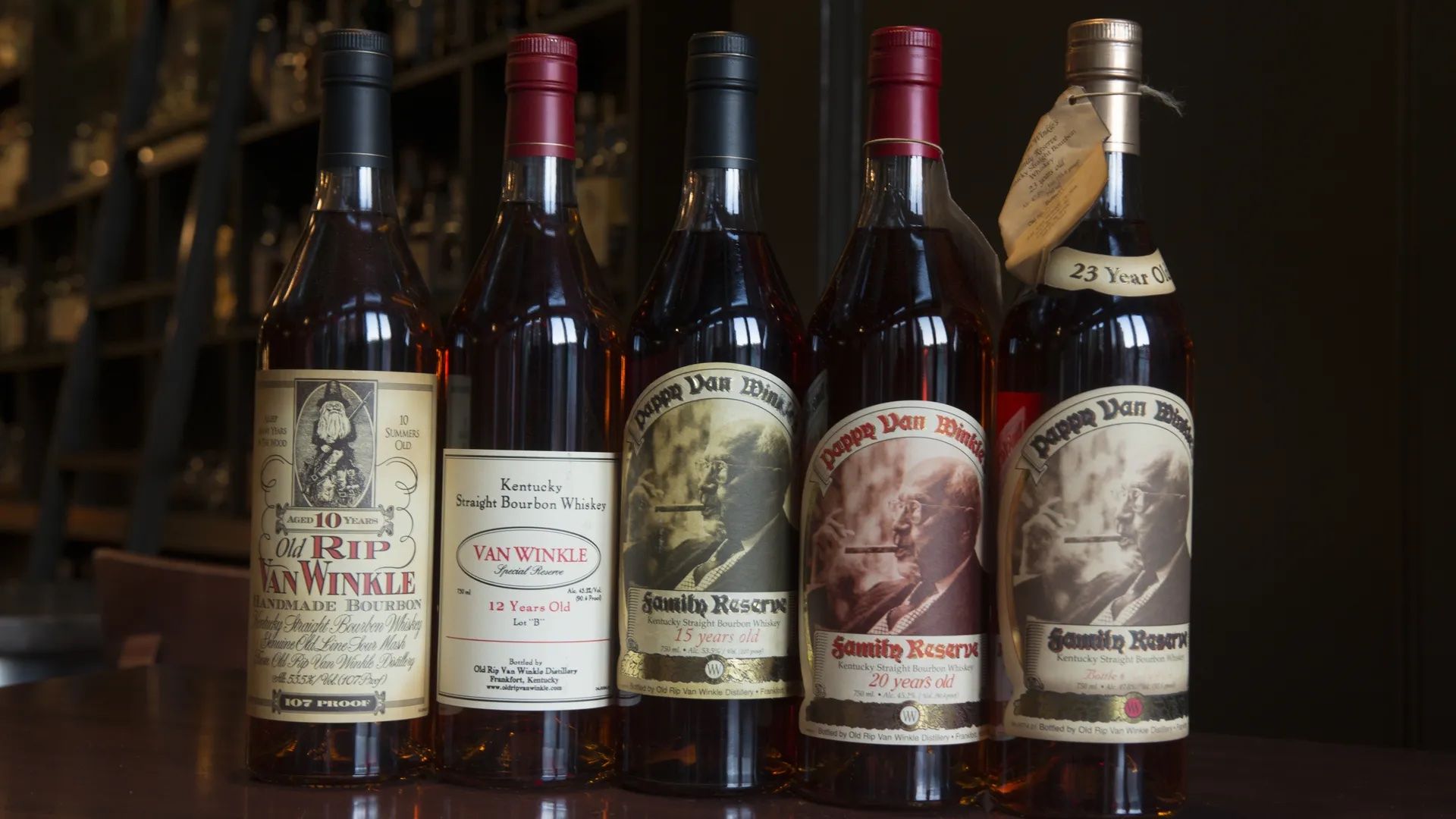 Five bottles of Pappy Van Winkle on a bar