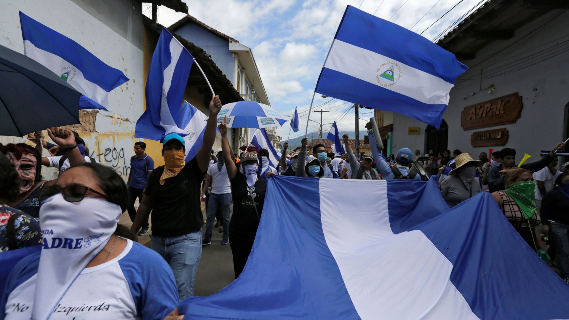 Anti-government protesters take part in a march dubbed 'United Nicaragua will never be defeated' in Granada, Nicaragua on August 25, 2018