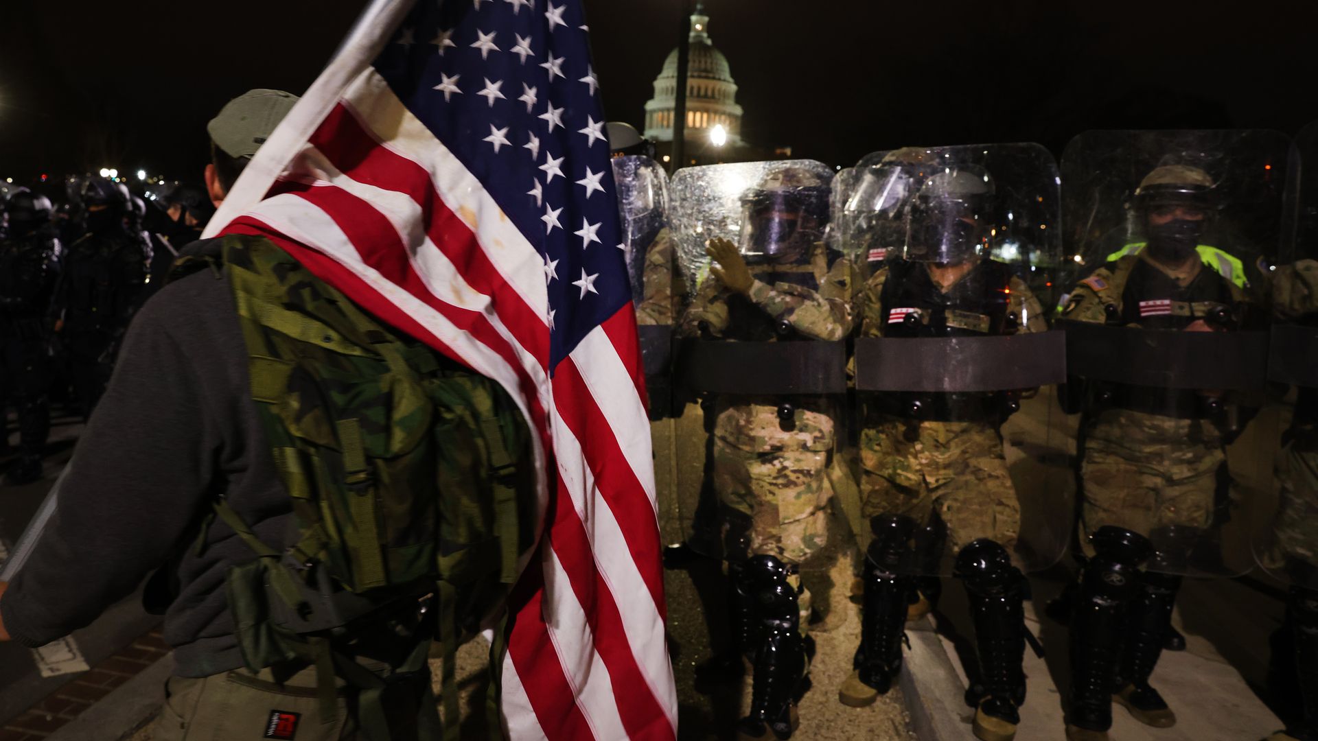  Members of the National Guard and the Washington D.C. police keep a small group of pro-Trump demonstrators away from the Capital after the insurrection o January 06, 2021 in Washington, DC. 