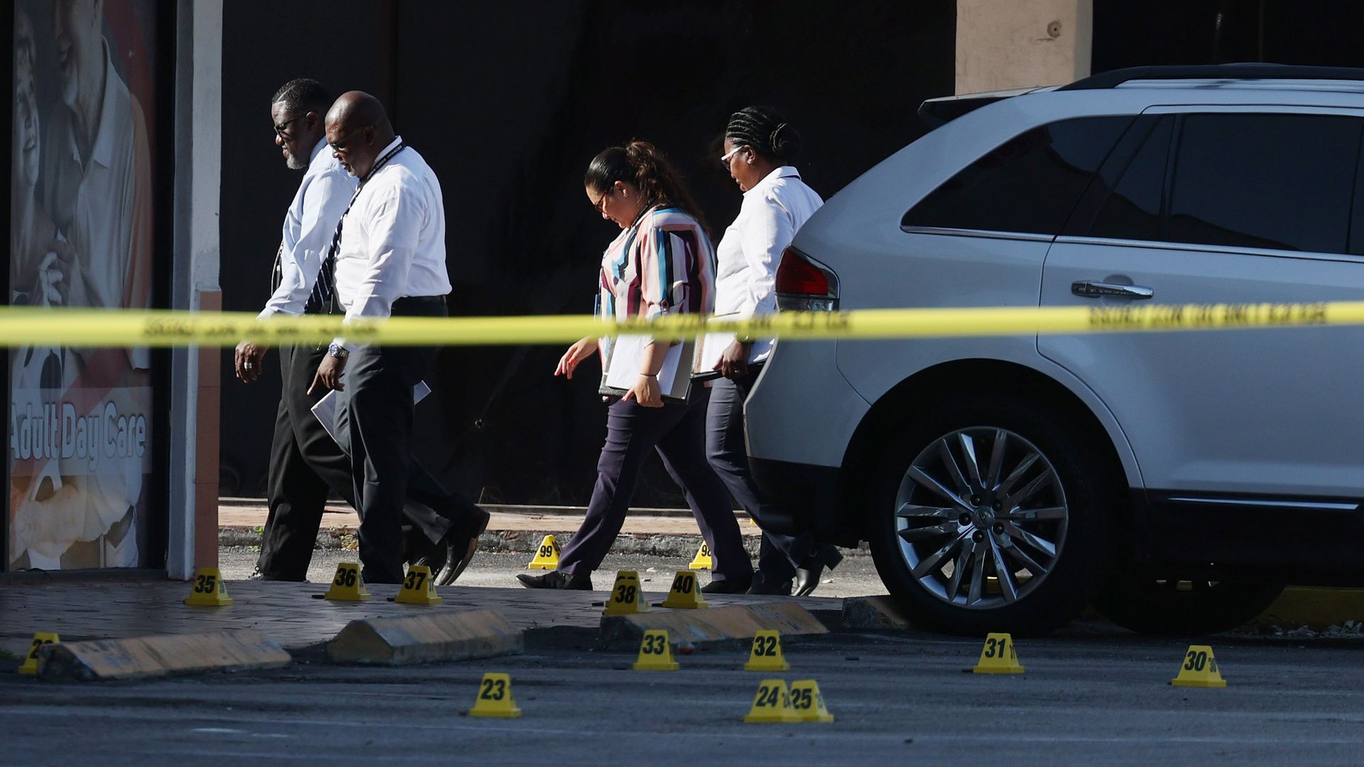 People walking outside the site of the shooting.