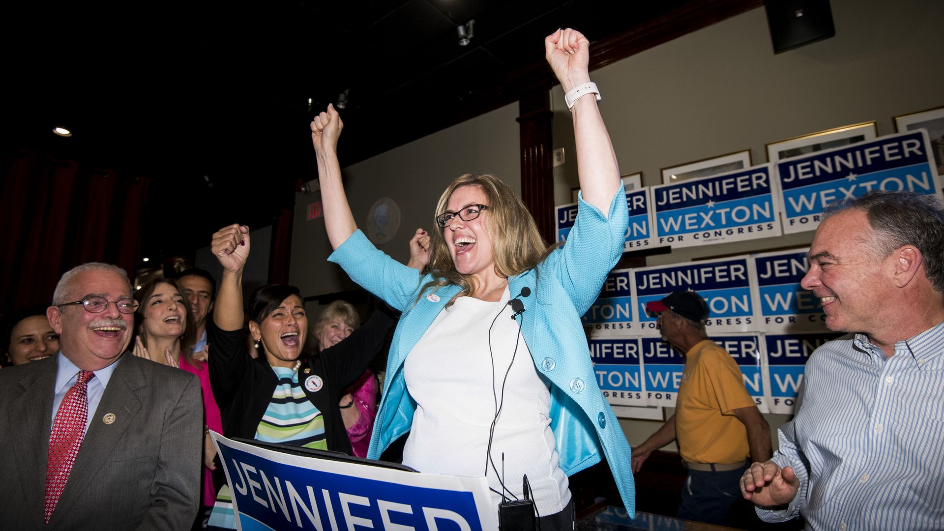 Jennifer Wexton celebrating her primary victory with her hands in the air