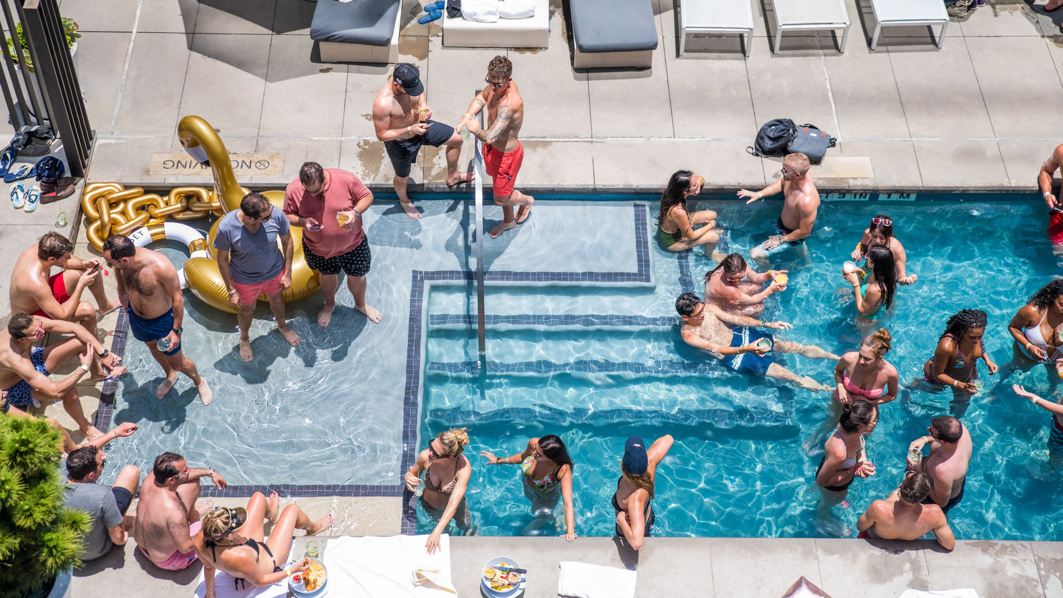 A pool with people inside of it.