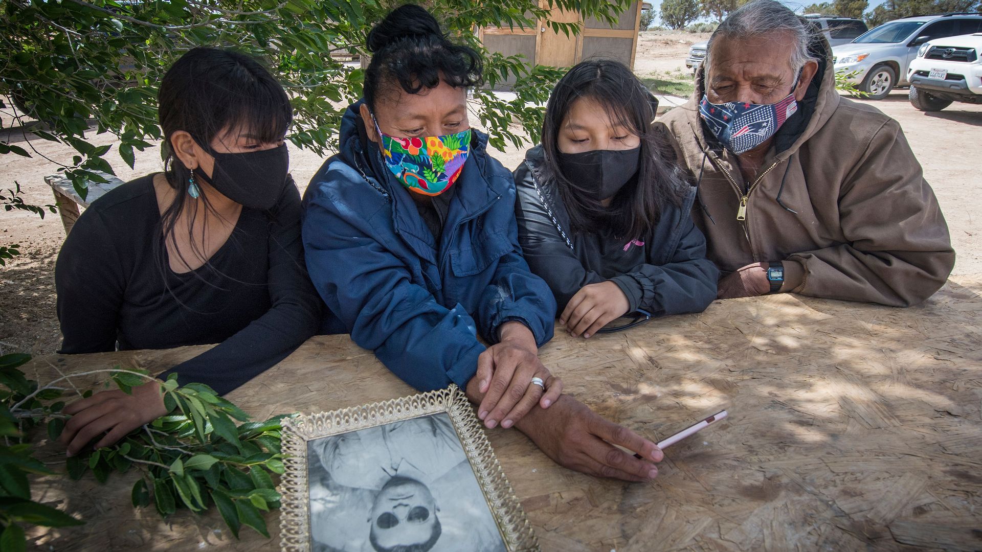 Navajo elder Emerson Gorman sits with his daughter Naiyahnikai, wife Beverly and grandchild near Steamboat, Arizona.
