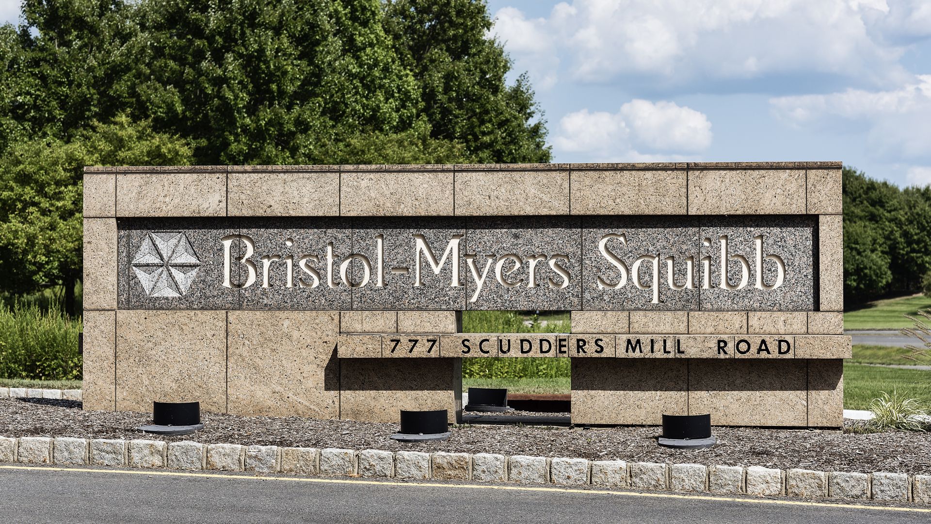 A sign with the Bristol-Myers Squibb name and logo.