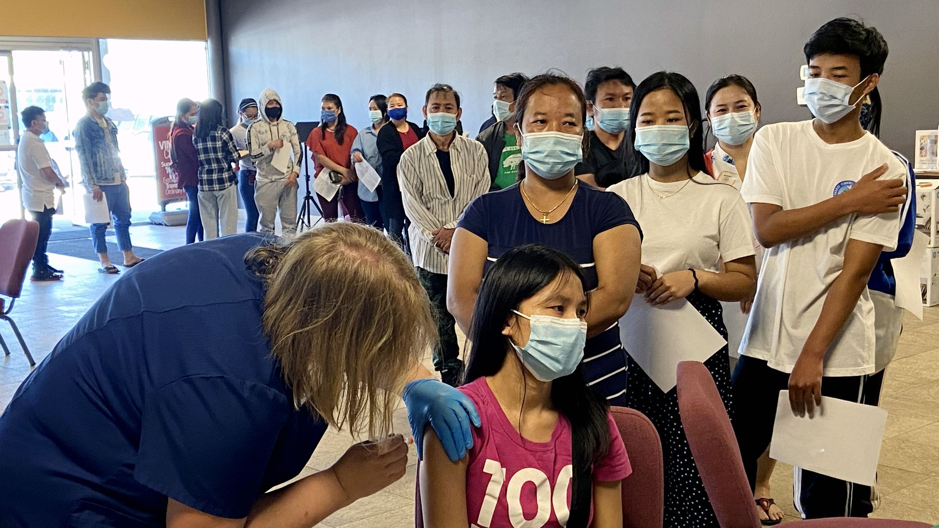 People getting vaccinated at EMBARC'S vaccine clinic.