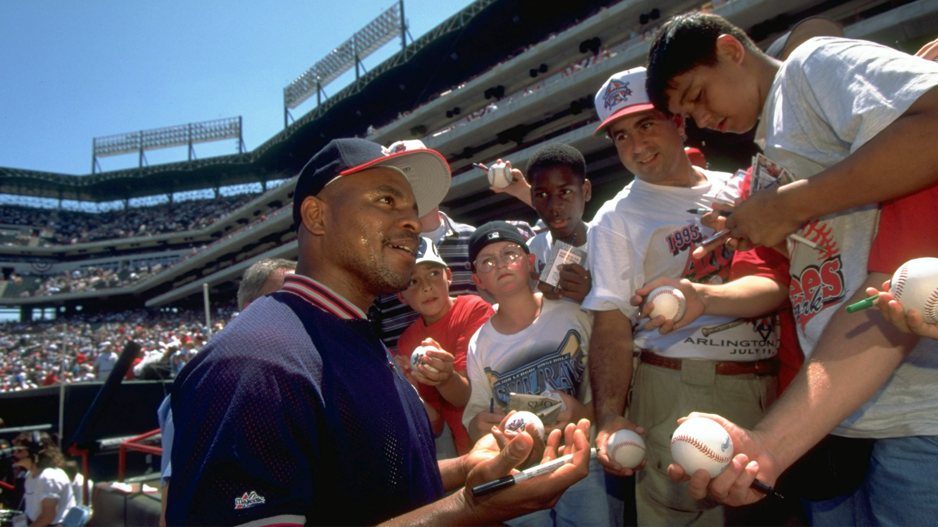 A photo of Cleveland Indians Albert Belle signing baseballs at the All-Star Game in 1995