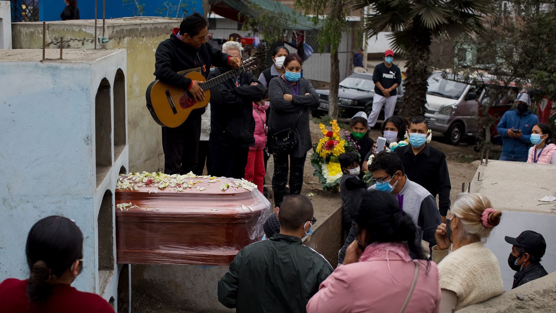 A Peruvian COVID victim is buried in Lima, June 1.