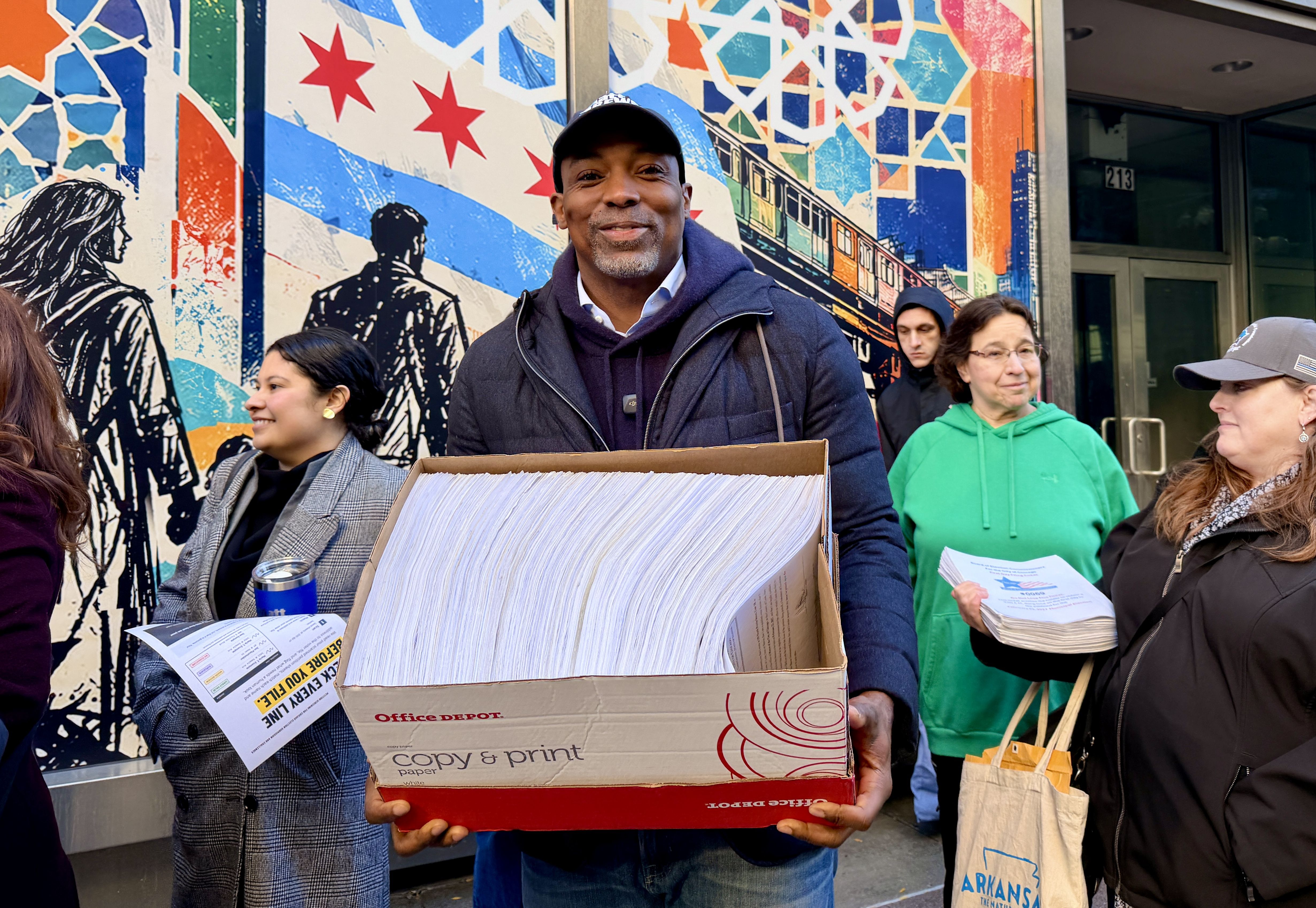 man with a box of papers