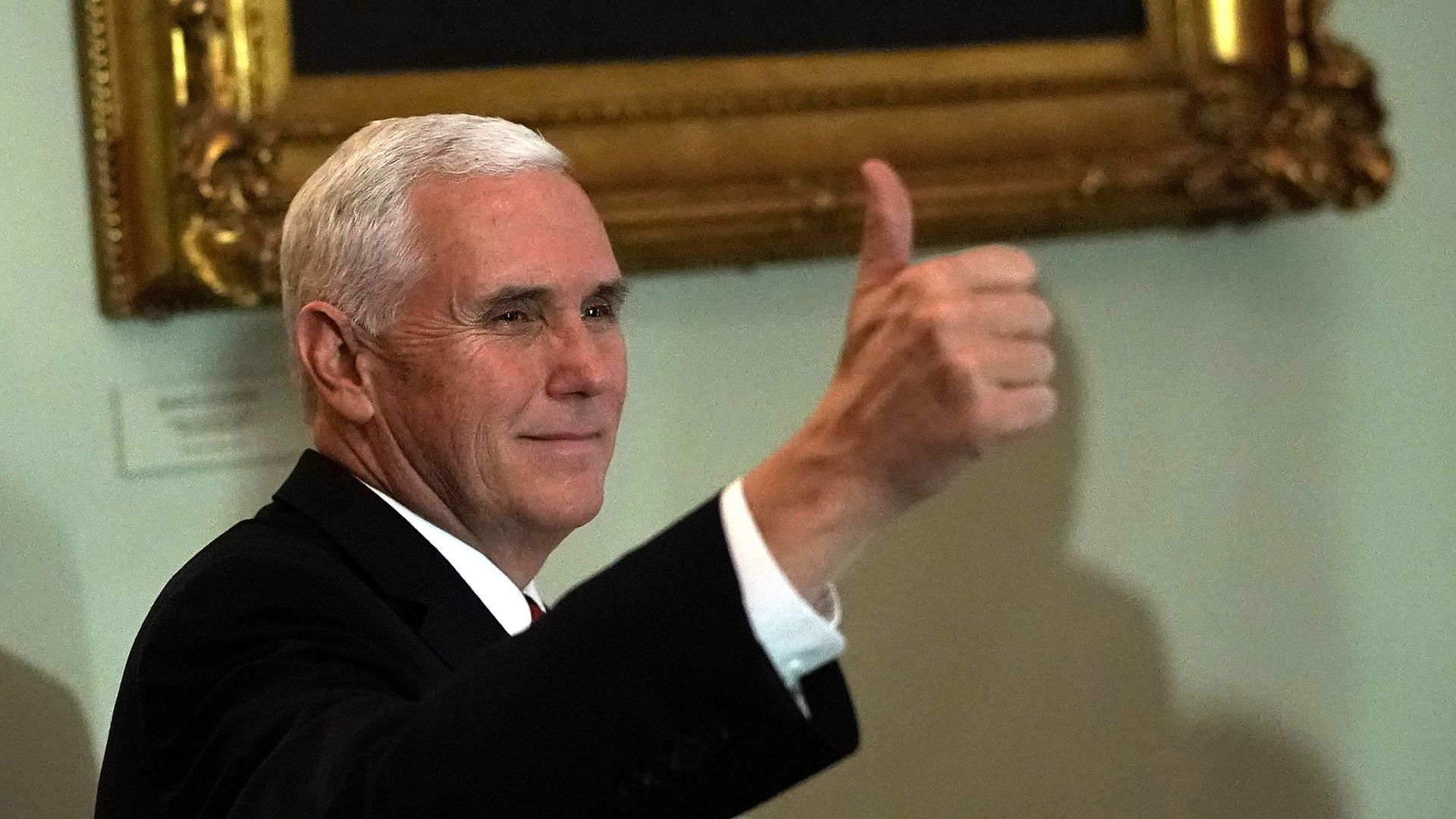 Pence giving a thumbs up