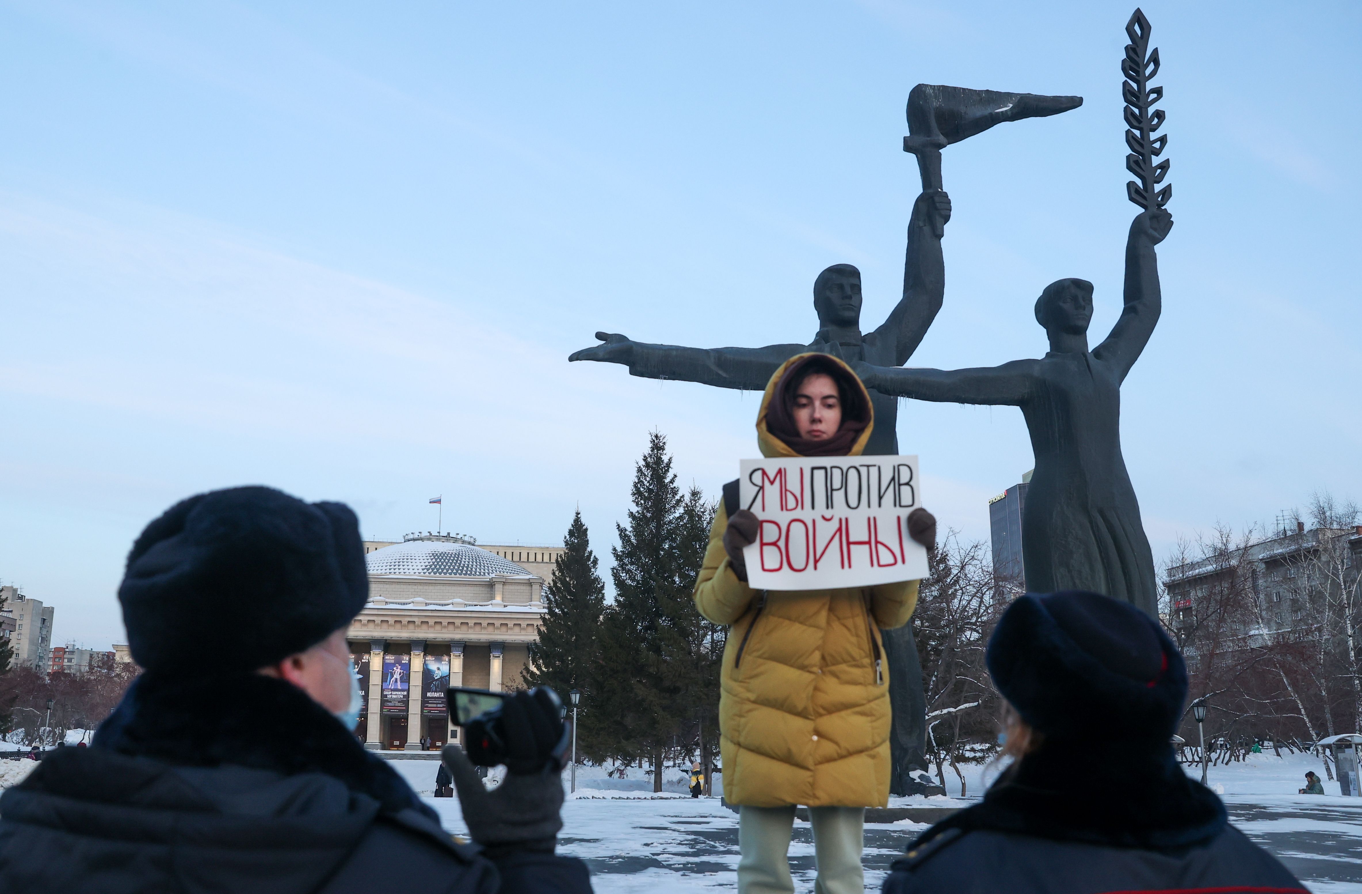 A person in Novosibirsk, Russia, holding a sign that reads "Me/We Against the War" during an anti-war rally on Feb. 24.
