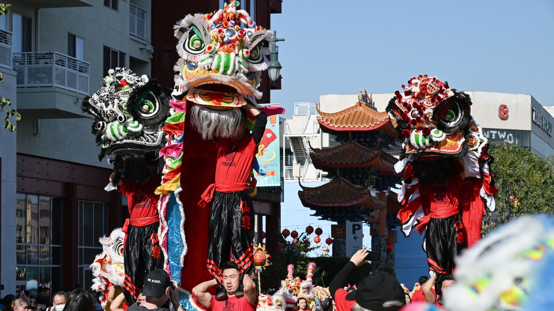 Dancers perform with giant dragon heads during a Lunar New Year parade. 