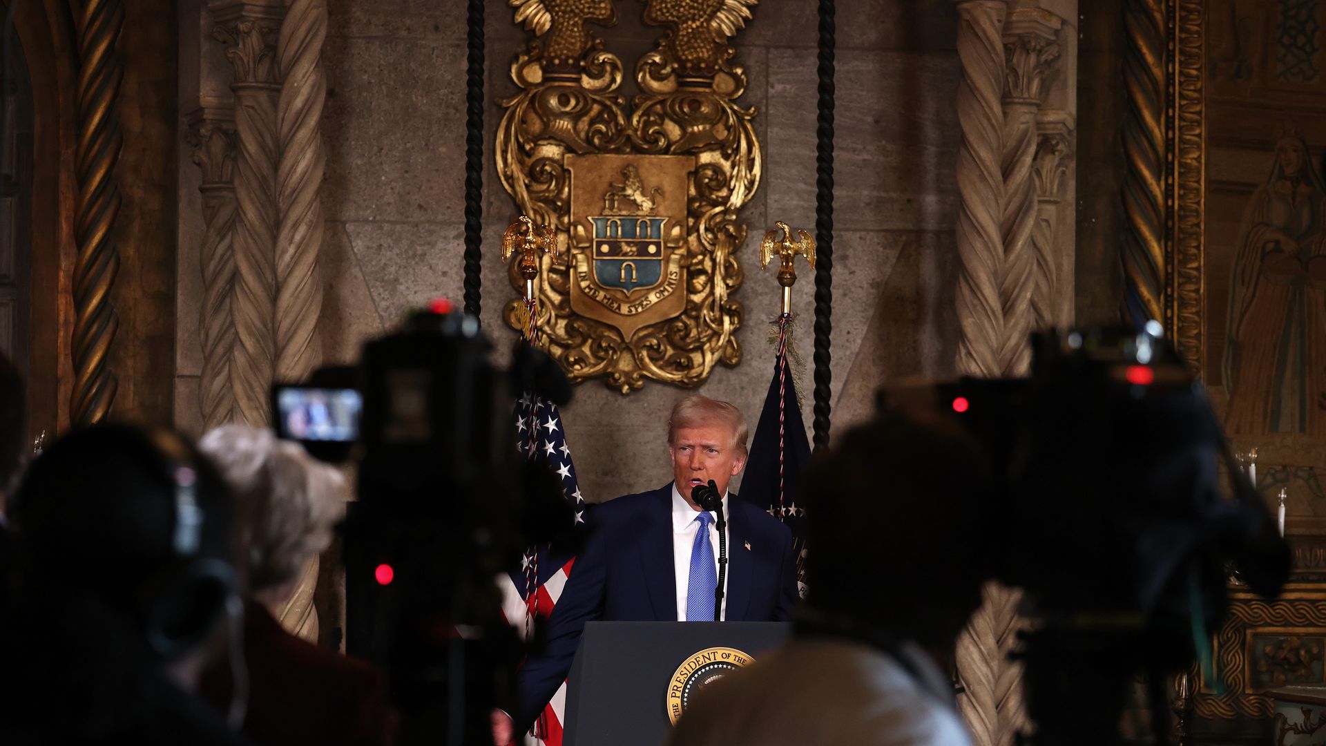 President Trump addresses the press at Mar-a-Lago after signing executive orders. 