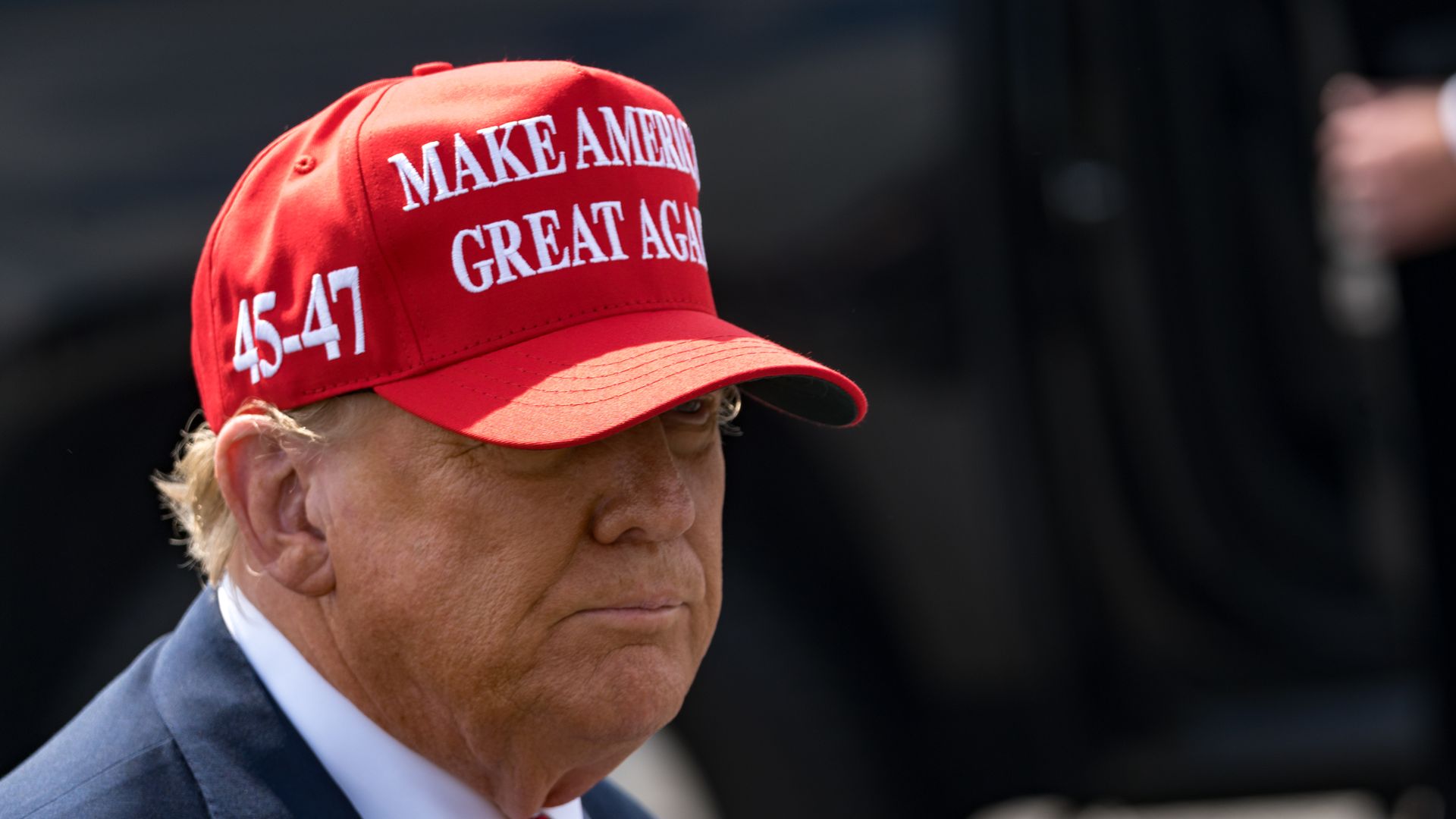 Trump in red MAGA hat