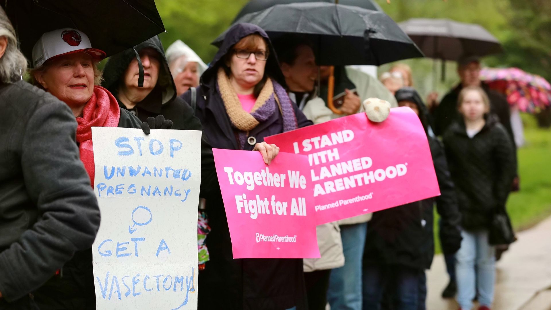In this image, protestors stand with pro-abortion signs.