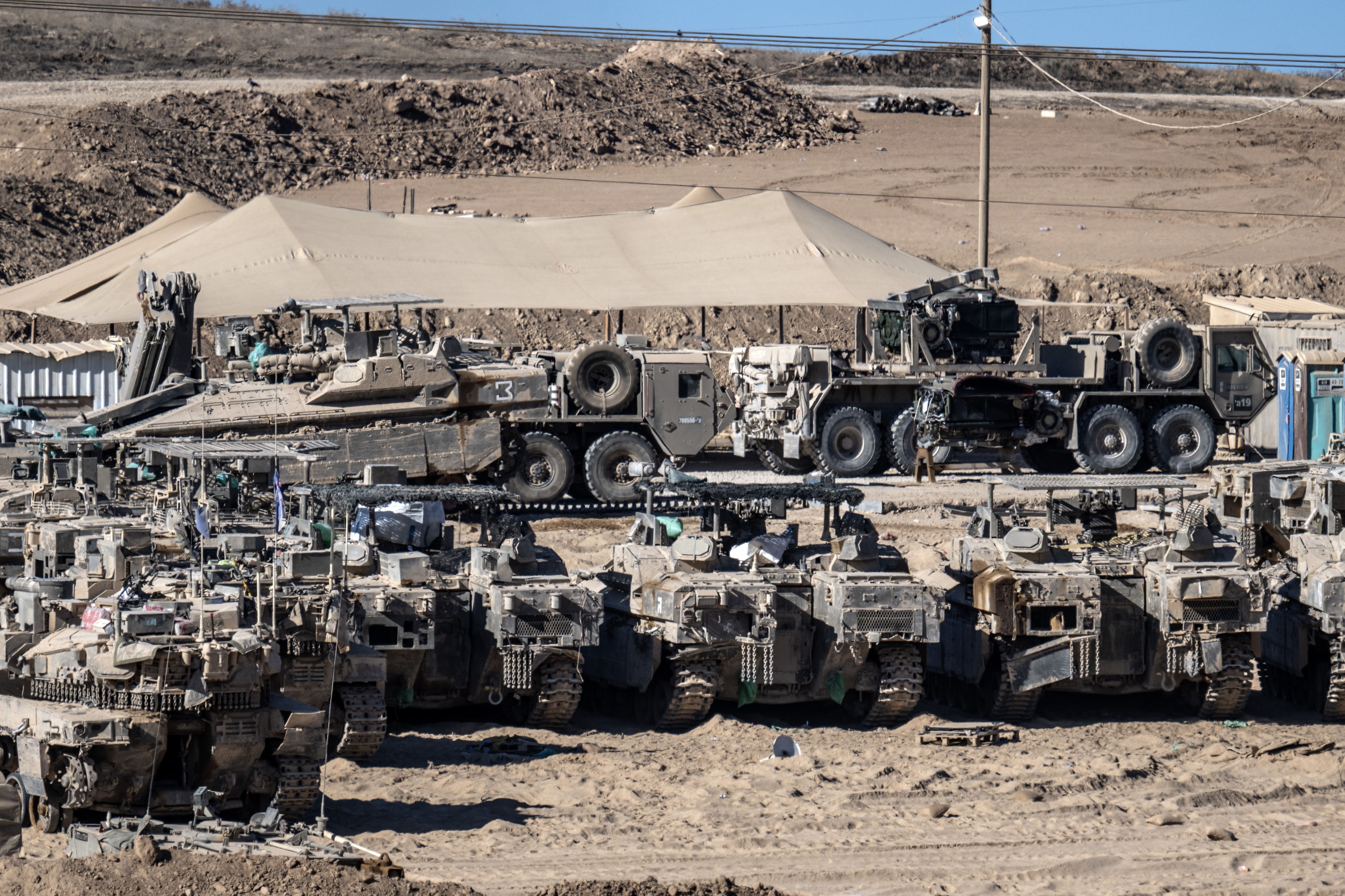 SDEROT, ISRAEL - OCTOBER 14: Israeli tanks and military vehicles are seen deployed with some military vehicles, helicopters, and drones patrolling along the border region following the implementation of the ceasefire between Israel and Hamas in Gaza and the withdrawal of Israeli forces inside the ye